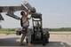 During Operation Grandstand, Staff Sgt. Joe McIlhon (left) and Senior Airman Benjamin Rogers (right) load missiles onto an F-16C aircraft on the west ramp of the 132nd Fighter Wing in Des Moines, Iowa, on August 6, 2010.  The 132nd Fighter Wing is conducting Operation Grandstand in preparation for the Operational Readiness Inspection which will be in October.  (US Air Force photo/Staff Sgt. Linda E. Kephart)(Released)