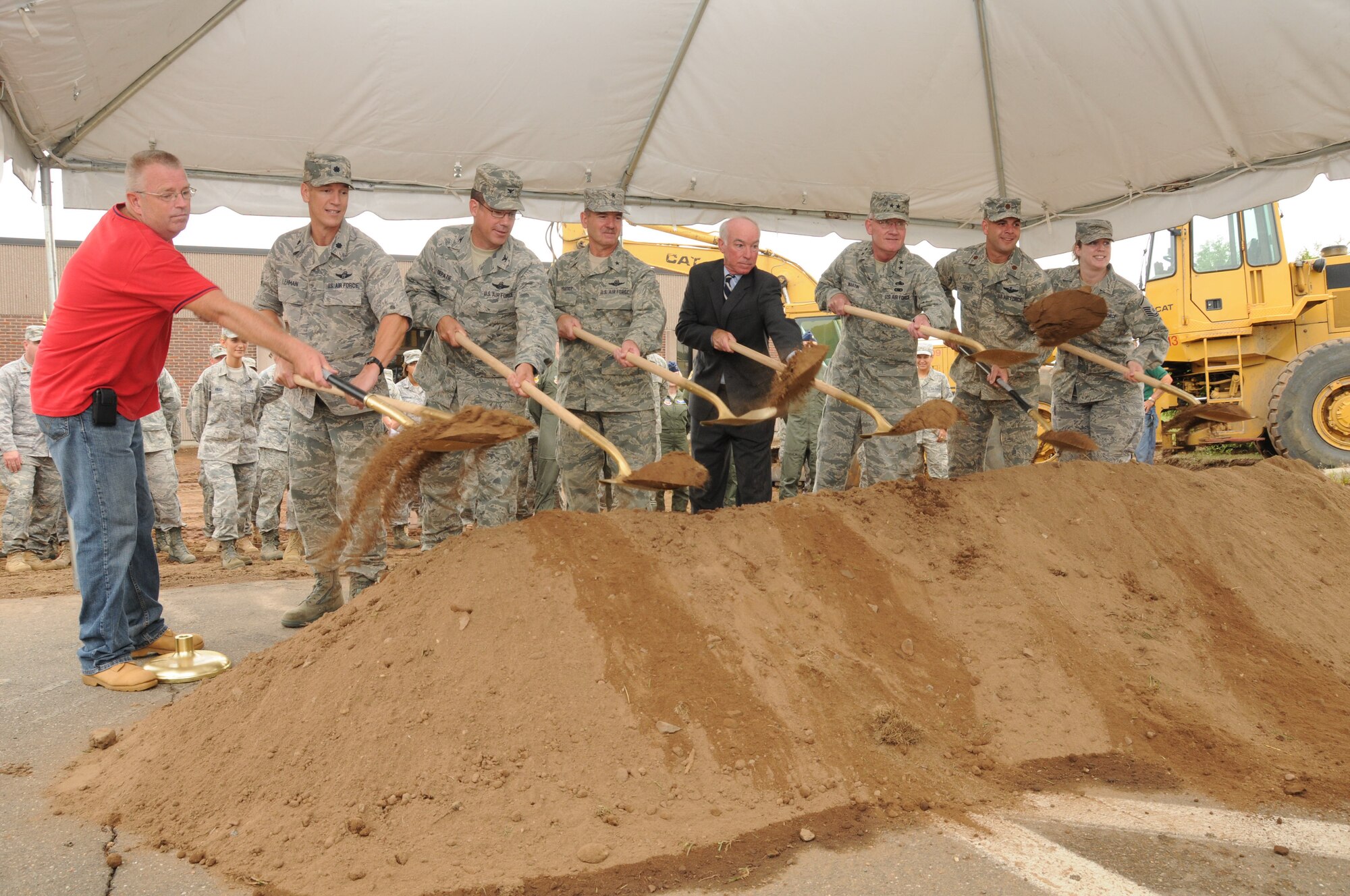 Mr. Scott Pearsall, Lt. Col. Aaron Lehman, commander, 609th Detachment, Col. Peter J. DePatie, commander, 103rd AOG, Brig. Gen. Daniel Peabody, Assist Adjutant for Air, Mr. Joe Courtney, U.S. Representative of the 2nd Congressional District, Maj. Gen. Thad Martin, The Adjutant General, Maj. Robert Feher, and Master Sgt. Heather Kirkham take part in the AOG’s ceremonial groundbreaking  Aug. 5, 2010, on base. (U.S. Air Force photo by Tech. Sgt. Erin McNamara)