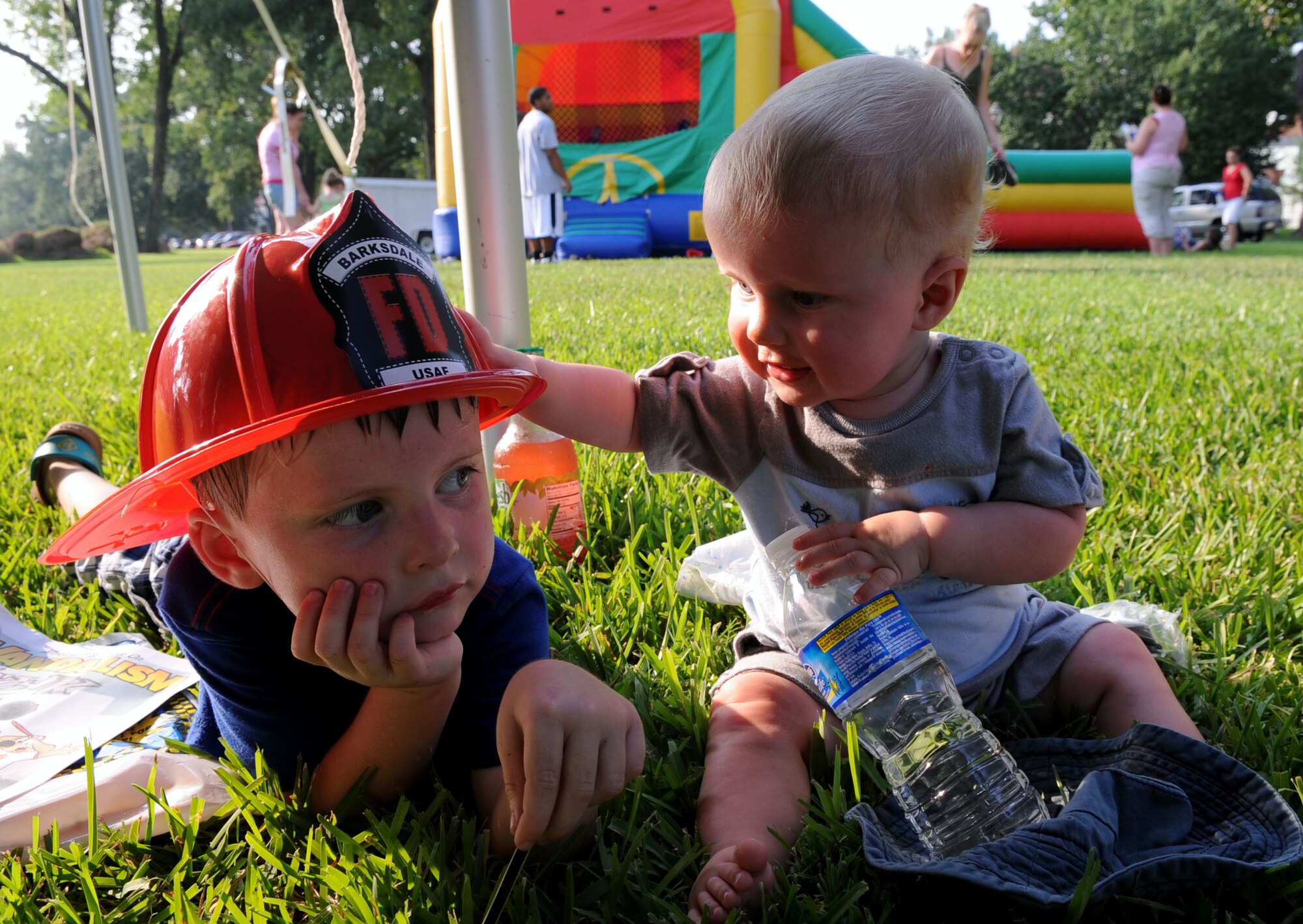 BARKSDALE AIR FORCE BASE, La. -- Sons of Marlena and Chris McGuire, Patrick, 4-years-old and Liam, nine months, relax under the tent during Barksdale?s third annual National Night Out Aug. 3. National Night Out is a community police- awareness-raising-event and "America's Night Out Against Crime." (U.S. Air Force photo by Senior Airman La'Shanette V. Garrett)(RELEASED)