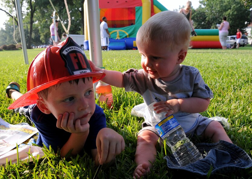 BARKSDALE AIR FORCE BASE, La. -- Sons of Marlena and Chris McGuire, Patrick, 4-years-old and Liam, nine months, relax under the tent during Barksdale's third annual National Night Out Aug. 3. National Night Out is a community police- awareness-raising-event and "America's Night Out Against Crime." (U.S. Air Force photo by Senior Airman La'Shanette V. Garrett)(RELEASED) 