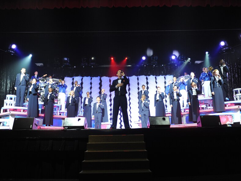 ABILENE, Texas -- Members of the Air Force entertainment group Tops in Blue sing during a group number at the Abilene Civic Center Aug. 2. Tops in Blue is one of the oldest and widely traveled entertainment groups of its kind, composed of 35 to 40 vocalists, musicians, dancers and technicians who perform free shows for military, their families and civilians throughout the world. The 2010 tour is a salute to the ideals we believe in as Americans and features the music of Stevie Wonder, Michael Buble, Montgomery Gentry, Lady Gaga, The Black Eyed Peas and more. The team is an all-active duty U.S. Air Force special unit made up of talented performers selected for their entertainment abilities. Since its first world tour in 1953, the group has also performed on film, produced albums and appeared on national television with such legends as Ed Sullivan and Bob Hope. (U.S. Air Force photo/ Senior Airman Jenifer H. Calhoun)