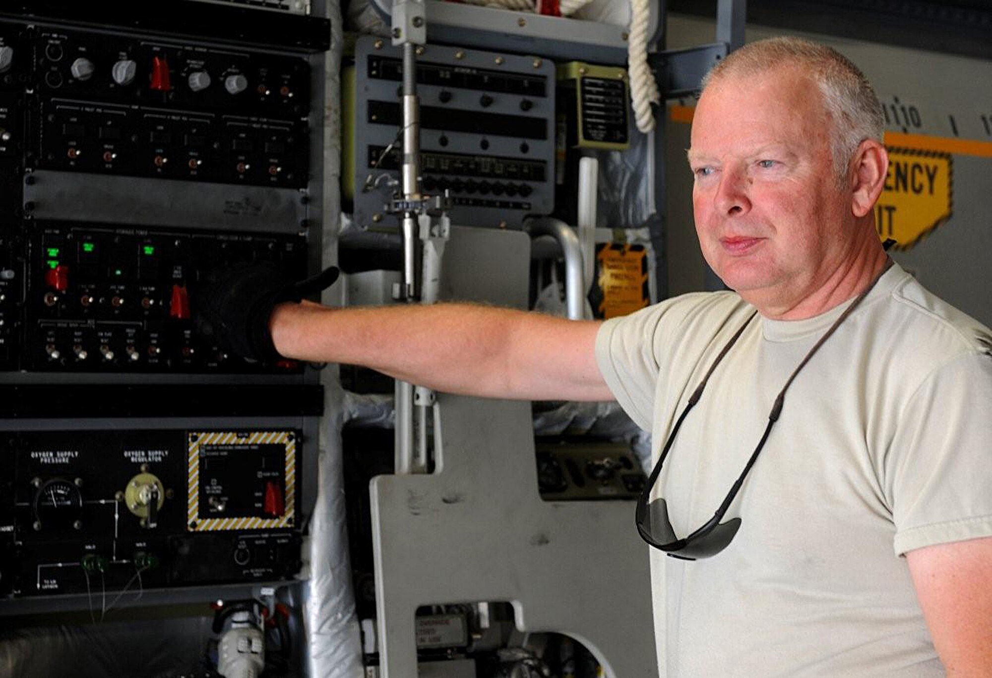 Master Sgt. David Schluttenhofer opens ramp doors on a C-17 for cargo loading in Southwest Asia.  Sergeant Schluttenhofer is deployed from the 446th Aircraft Maintenance Squadron, Joint Base Lewis-McChord, Wash.  (U.S. Air Force photo/Senior Airman Michael Means)