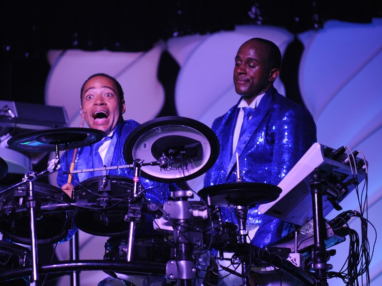 ABILENE, Texas -- Airman 1st Class Jonathan Velasquez, Tops in Blue keyboardist, and Senior Airman Breyson Robinson, Tops in Blue drummer, perform a comedic drum duet at the Abilene Civic Center Aug. 2. Tops in Blue is one of the oldest and widely traveled entertainment groups of its kind, composed of 35 to 40 vocalists, musicians, dancers and technicians who perform free shows for military, their families and civilians throughout the world. The 2010 tour is a salute to the ideals we believe in as Americans and features the music of Stevie Wonder, Michael Buble, Montgomery Gentry, Lady Gaga, The Black Eyed Peas and more. The team is an all-active duty U.S. Air Force special unit made up of talented performers selected for their entertainment abilities. Since its first world tour in 1953, the group has also performed on film, produced albums and appeared on national television with such legends as Ed Sullivan and Bob Hope. (U.S. Air Force photo/ Senior Airman Jenifer H. Calhoun)