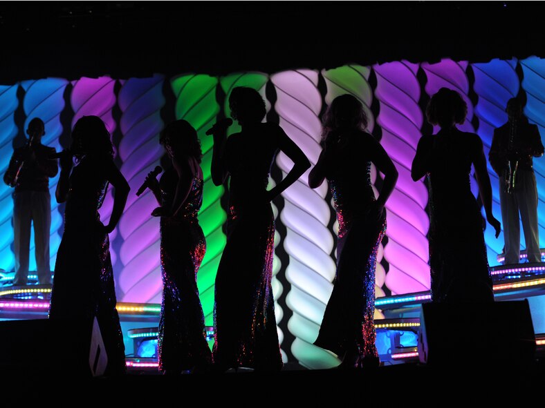 ABILENE, Texas -- Ladies of Tops in Blue sing during the free “We Believe” show at the Abilene Civic Center Aug. 2. Tops in Blue is one of the oldest and widely traveled entertainment groups of its kind, composed of 35 to 40 vocalists, musicians, dancers and technicians who perform free shows for military, their families and civilians throughout the world. The 2010 tour is a salute to the ideals we believe in as Americans and features the music of Stevie Wonder, Michael Buble, Montgomery Gentry, Lady Gaga, The Black Eyed Peas and more. The team is an all-active duty U.S. Air Force special unit made up of talented performers selected for their entertainment abilities. Since its first world tour in 1953, the group has also performed on film, produced albums and appeared on national television with such legends as Ed Sullivan and Bob Hope. (U.S. Air Force photo/ Senior Airman Jenifer H. Calhoun)
