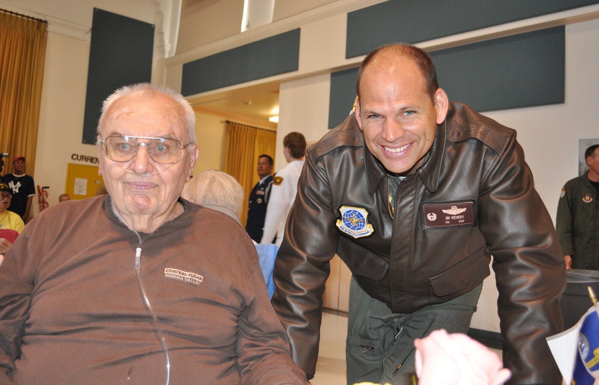 Col. James Vechery, 60th Air Mobility Wing commander, shares a special moment with a veteran at the California Veterans Home in Yountville, Calif. (U.S. Air Force photo)