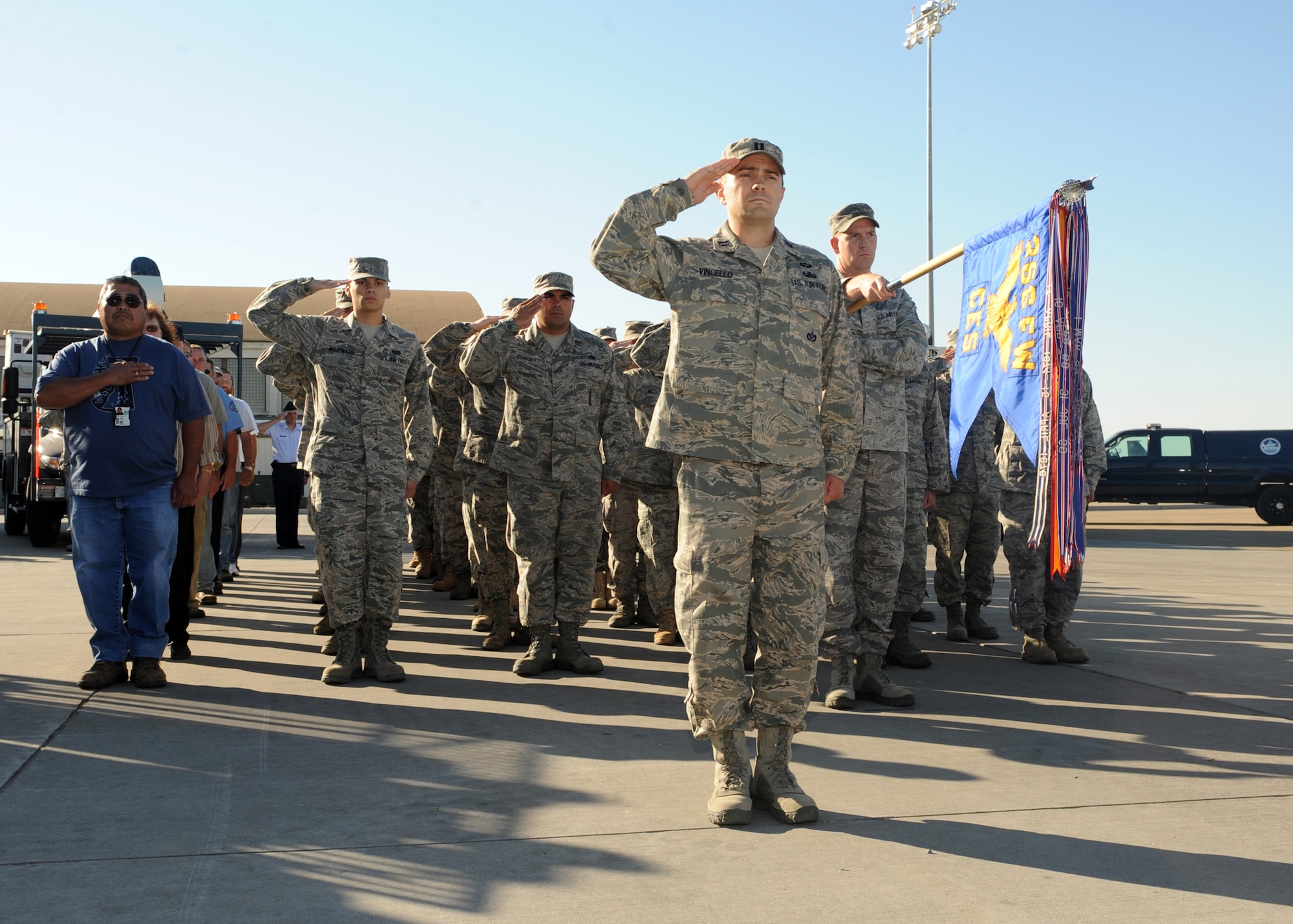 MOUNTAIN HOME AIR FORCE BASE, Idaho --  Airmen from the Civil Engineer Squadron salute during a Change of Command Ceremony on the Aug 2. The CES change of command finished up the summer's season of change of command ceremonies. (Airman 1st Class Debbie Lockhart)