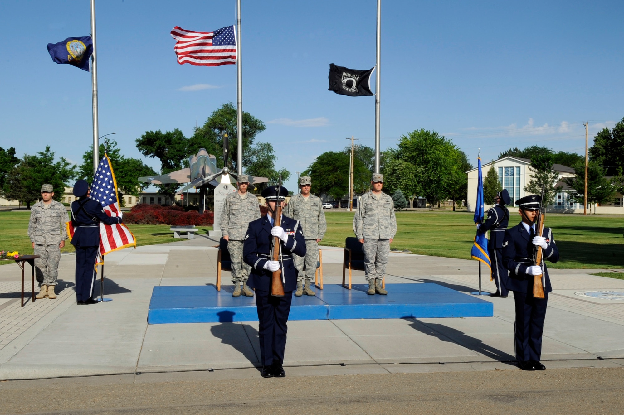 MOUNTAIN HOME AIR FORCE BASE, Idaho - While the MHAFB Honor Guard posts the colors the official party renders the respect to the flag June 30. The 366th Communications Squadron welcomed Maj. Ted Glasco as thier new commander. (U.S. Air Force photo by Airman 1st Class Angelina Drake)