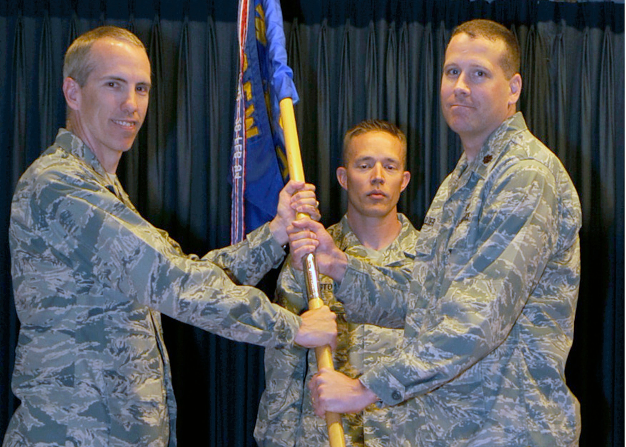 MOUNTAIN HOME AIR FORCE BASE, Idaho -- Maj. Mitchell Elder, incoming 366th Contracting Squadron commander, receives the guideon during the change of command ceremony held in the Gunfighter Club June 22. (U.S. Air Force photo by Airman 1st Class Angelina Drake)