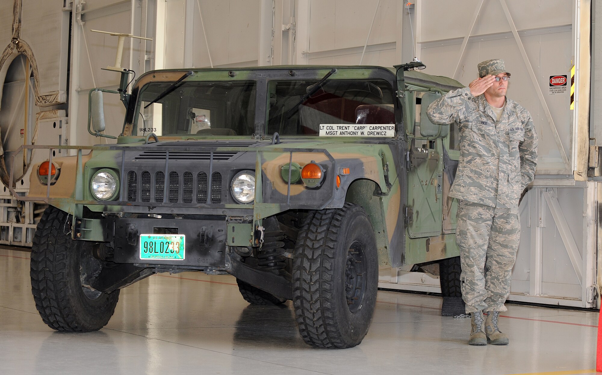 MOUNTAIN HOME AIR FORCE BASE, Idaho-- Staff Sgt. Lee Vice, 726th Air Control Squadron, salutes after unveiling the name of the new squadron commander on a humvee, during a Change of Command Ceremony June 17. Lt. Col. Carpenter previously served as the 607th Air Control Squadron Director of Operations at Luke Air Force Base, Az. (U.S. Air Force photo by Airman 1st Class Debbie Lockhart)