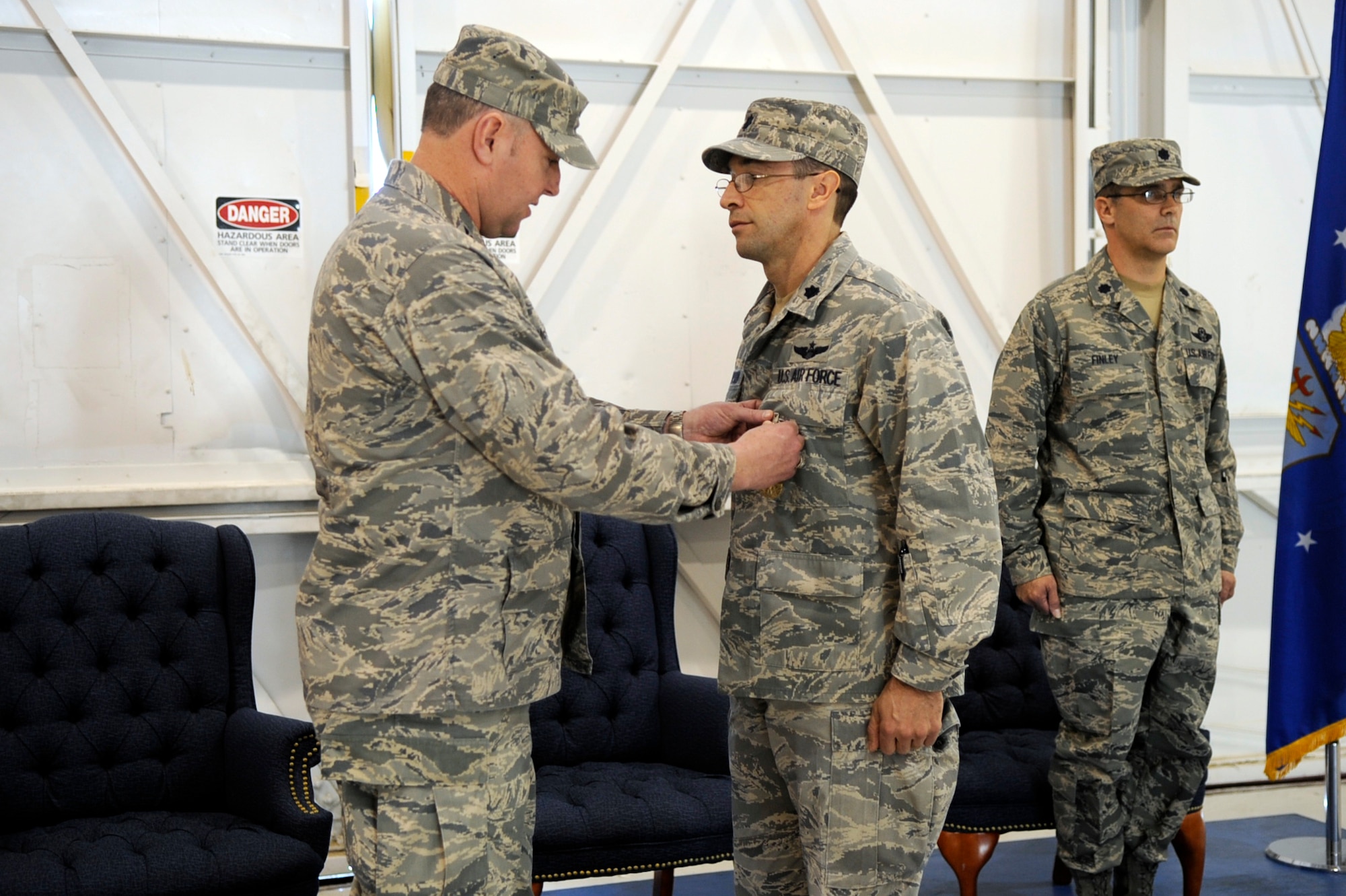 MOUNTAIN HOME AIR FORCE BASE, Idaho - During the 366th Operation Support Squadron's change of command Lt. Col. Mark Thompson receives the Meritorious Service Medal for his combined efforts as commander May 27. Taking over as commander of OSS is Lt. Col. Charlie Finley. (U.S. Air Force photo by Airman 1st Class Angelina Drake)