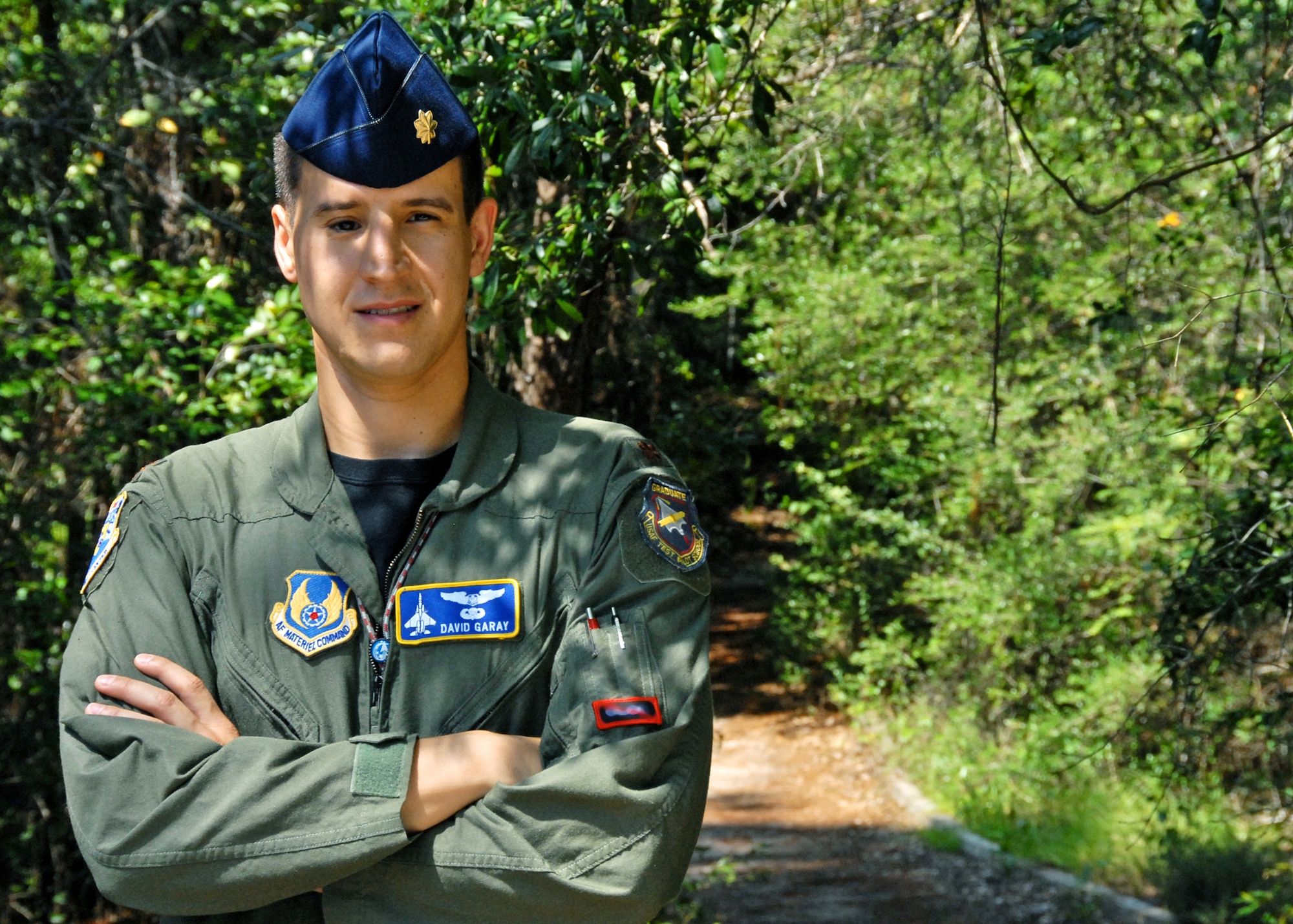 Maj. David Garay survived a 50-foot fall during a hike while he was a cadet at the U.S. Air Force Academy, Colo. Although bones were broken in his face, he tried to climb down to get help. The head trauma he suffered almost cost him his dream of flying for the Air Force, but he overcame it all to become a flight test engineer. Major Garay is an Air Armament Center executive officer. (U.S. Air Force photo illustration/Samuel King Jr.)