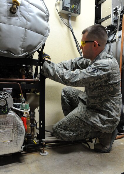 DYESS AIR FORCE BASE, Texas – Senior Airman Lucas Stair, 7th Medical Group, repairs an exhaust manifold for a pre-vac steam sterilizer at the Medical Group here July 15. Airman Stair found a malfunction during an annual preventative maintenance check up. Annual inspections are preformed to insure the equipment stays mission ready. (U.S. Air Force Photo by/ Airman 1st Class Chelsea Cummings)