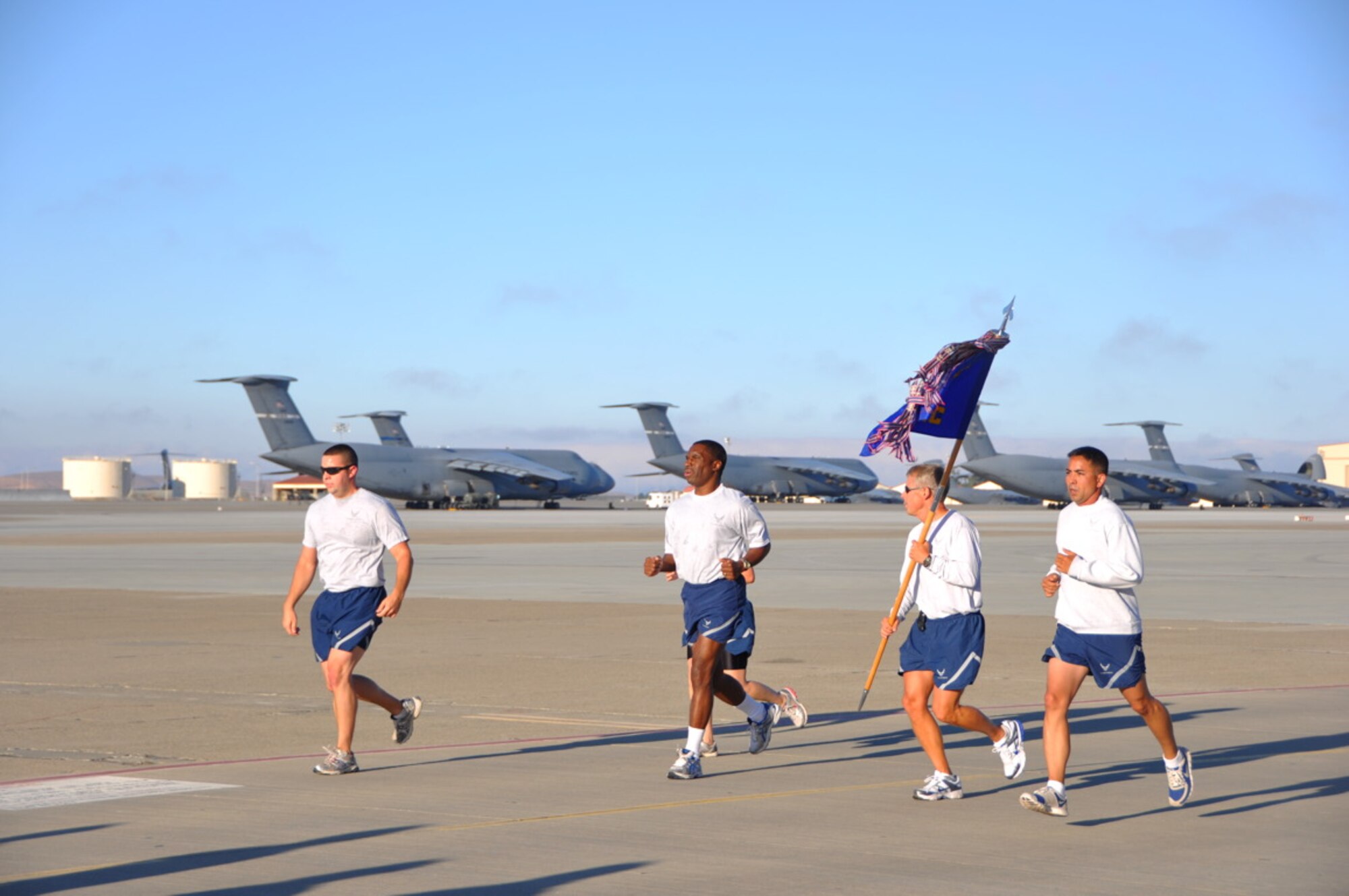 Airmen from Team Travis participate July 27 in the 60th Airmobility Wing "Fun Run." The two-mile run is a way for Airmen to interact with other Airmen from all squadrons from around base, as well as promote unity, morale and good health. (U.S. Air Force photo/Capt. Melissa Milner)