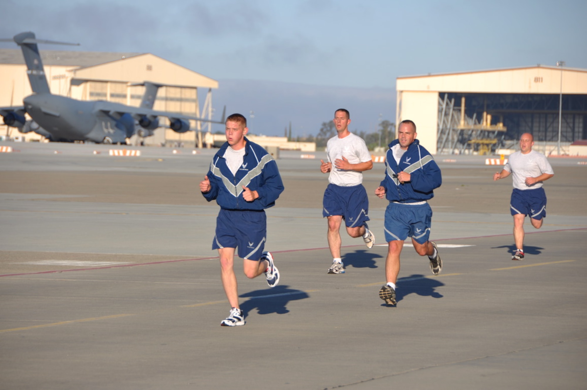 Airmen from Team Travis participate July 27 in the 60th Airmobility Wing "Fun Run." The two-mile run is a way for Airmen to interact with other Airmen from all squadrons from around base, as well as promote unity, morale and good health. (U.S. Air Force photo/Capt. Melissa Milner)