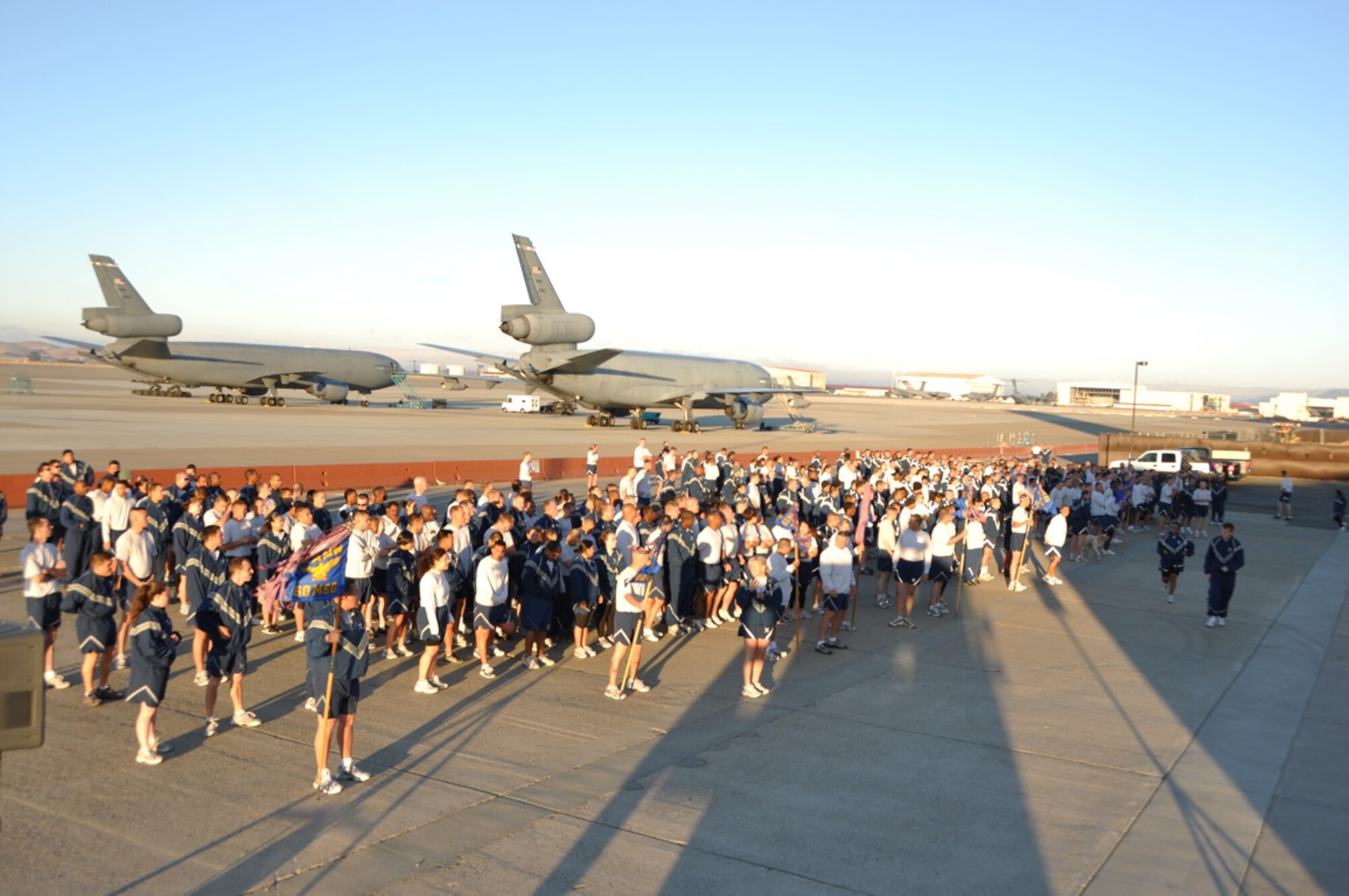 Airmen from Team Travis participate July 27 in the 60th Airmobility Wing "Fun Run." The two-mile run is a way for Airmen to interact with other Airmen from all squadrons from around base, as well as promote unity, morale and good health. (U.S. Air Force photo/Capt. Melissa Milner)