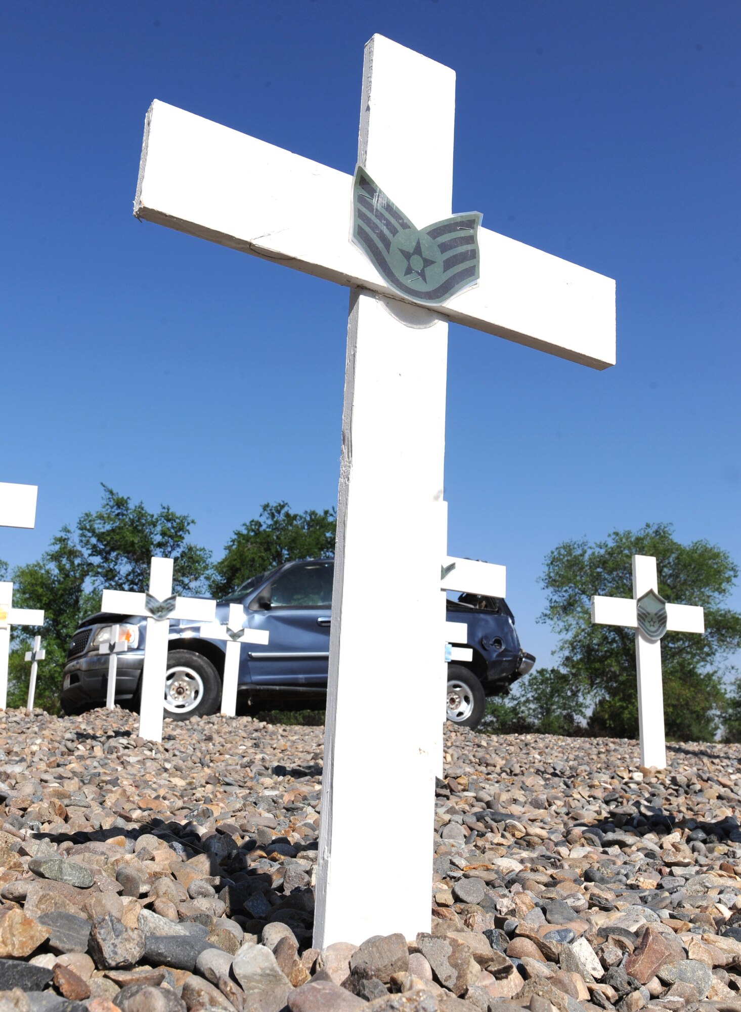 MOUNTAIN HOME AIR FORCE BASE, Idaho - Buckle up and survive. The Critical Days of Summer traffic safety display has been relocated and refreshed. Since the crosses and vehicle were put in place on 26 May the safety office has added 9 crosses for recent Air Force fatalities: 1-Airman; 4-Airman First Class; 1-Staff Sergeant; 2-Technical Sergeants; 1-Lt Colonel. (U.S. Air Force photo by Airman 1st Class Debbie Lockhart)