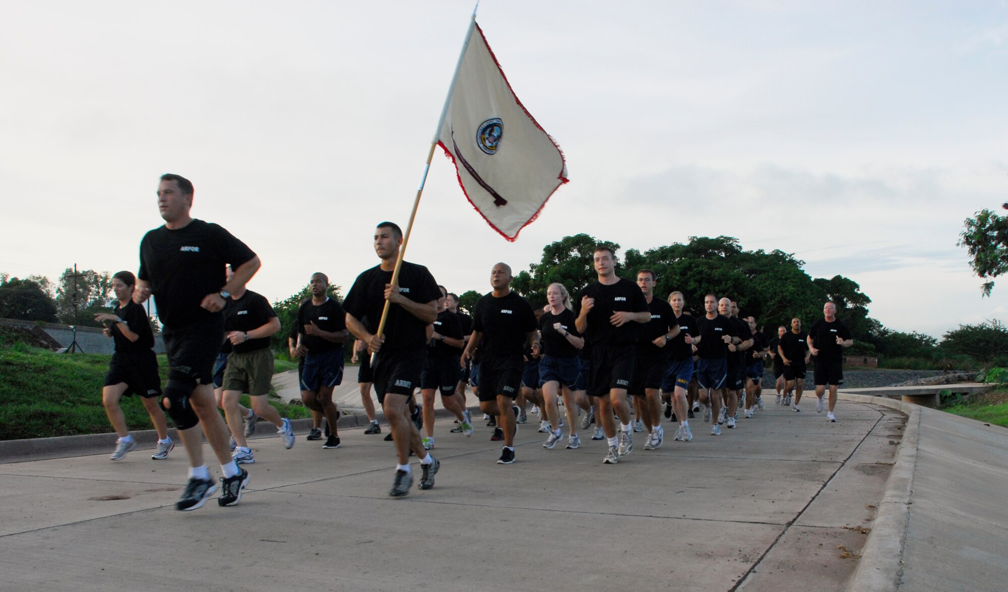 SOTO CANO AIR BASE, Honduras --  Members of Joint Task Force-Bravo's Army Forces close in on the finish line during the JTF-Bravo Run here Aug. 6. The monthly run encourages esprit de corps and fitness. (U.S. Air Force photo/Tech. Sgt. Benjamin Rojek)