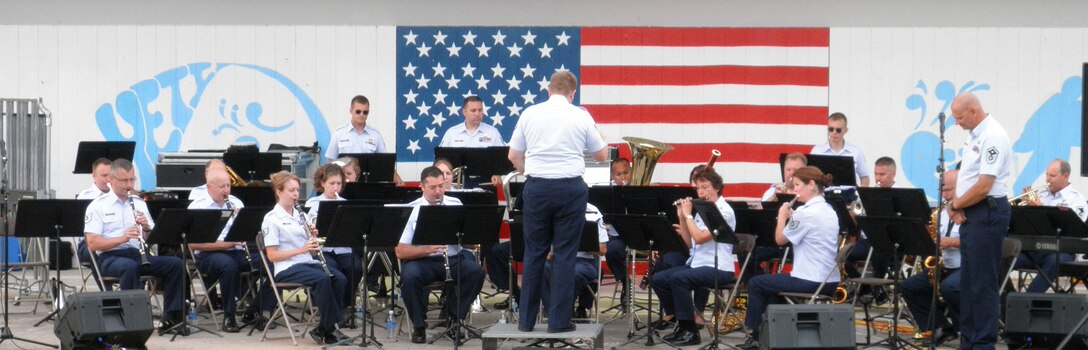 The 566th AF Band performs at Manistique, MI as part of the 2010 Annual Training tour of the Upper Peninsula.  SrA Cody Halberstadt conducted the band on several numbers and MSgt William Swanberg announced the opener and closer.