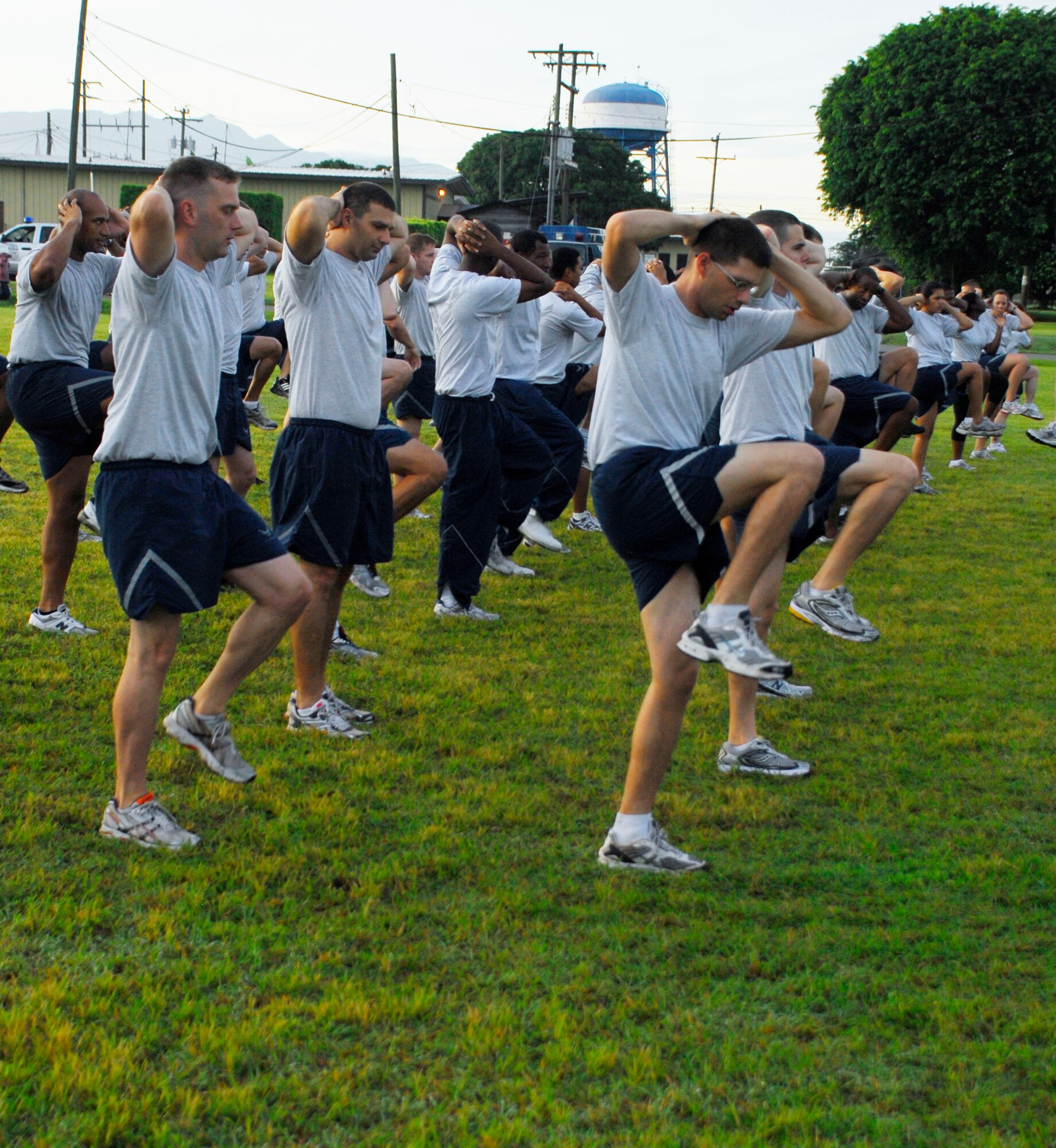 SOTO CANO AIR BASE, Honduras --  Members of the 612th Air Base Squadron perform warm-up exercises before the Joint Task Force-Bravo Run here Aug. 6. The monthly run encourages esprit de corps and fitness. (U.S. Air Force photo/Tech. Sgt. Benjamin Rojek)