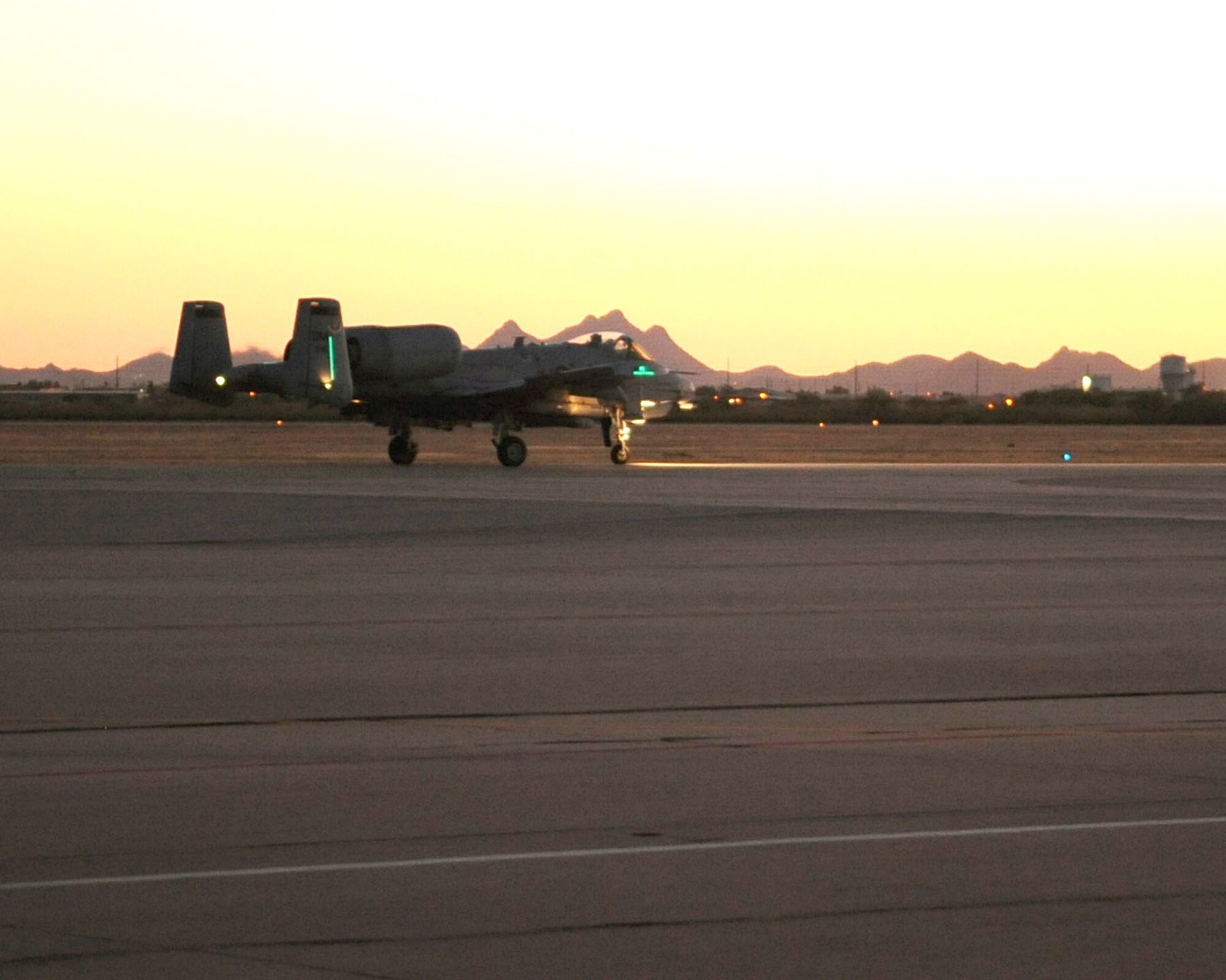 An A-10C Thunderbolt II moves down the taxiway at David-Monthan Air Force Base, Ariz., June 23, 2010, prior to taking off for a night flying mission.  As part of the A-10C Pilot Initial Qualification course curriculum all pilots must learn to execute night flying missions through six hours of academic classes, five hours in the A-10 flight simulator and eight training flights. (U.S. Air Force photo/Airman 1st Class Jerilyn Quintanilla)