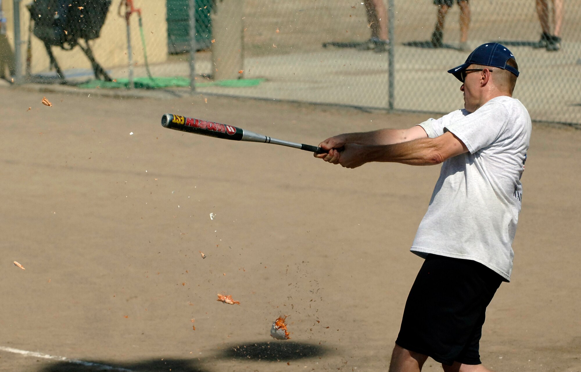 MOUNTAIN HOME AIR FORCE BASE, Idaho -- Col. Pete Lee, 366th Fighter Wing vice commander, hits a grape fruit disguised as a softball during the Commanders vs. First Sergeants game the annual Operation Warm Heart Softball Tournament July 29. Twenty four teams competed in the three day tournament raising $5,500 for Operation Warm Heart. (U.S. Air Force photo by Airman 1st Class Samuel Anderson)