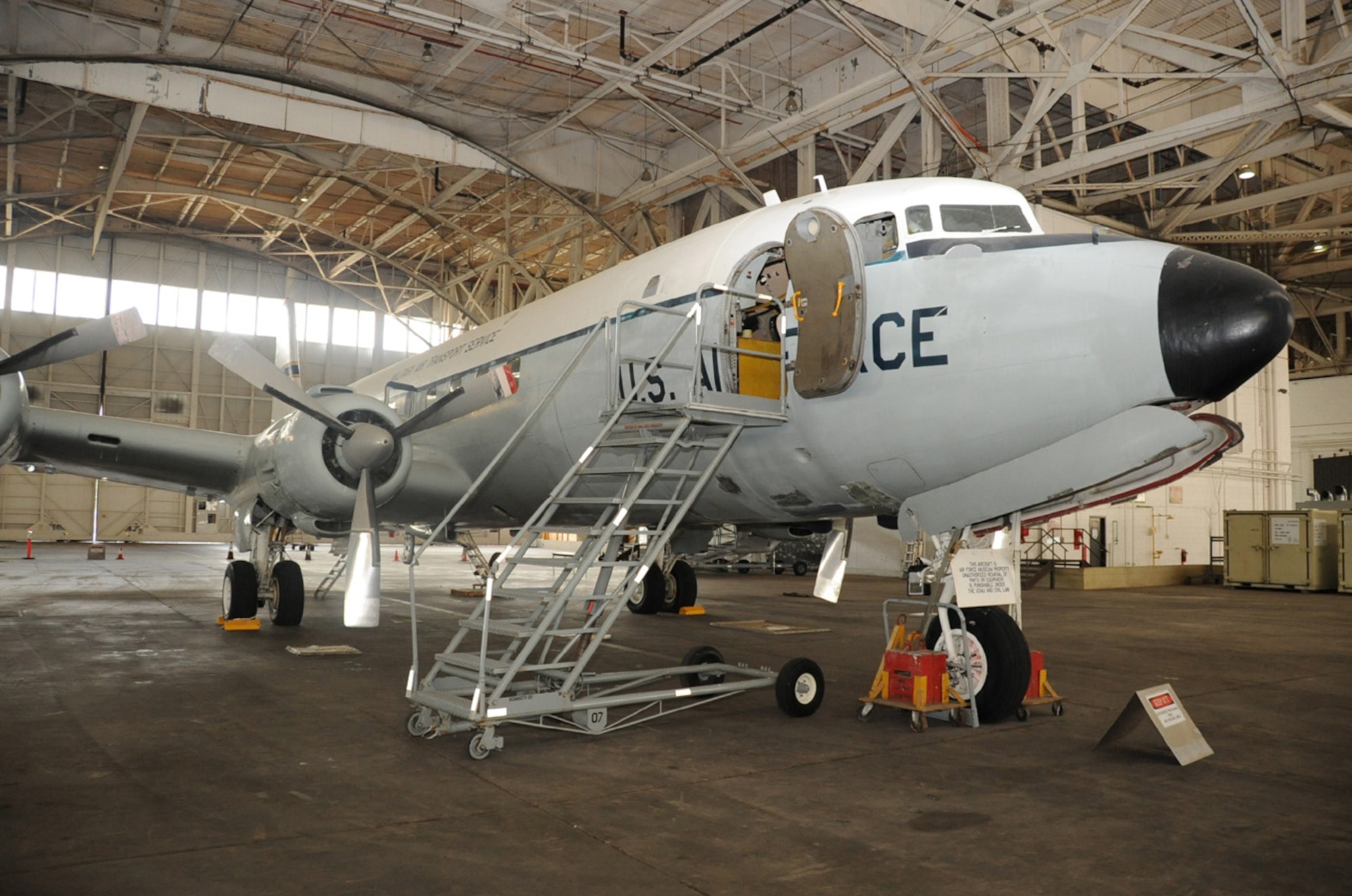 JOINT BASE MCUIRE-DIX-LAKEHURST, N.J. -- The C-118 usually on display in front of the McGuire passenger terminal rests in a hangar for restoration, Aug. 3, 2010. The Liftmaster will have its propellers buffed and stripped of the Navy colors and replaced with the Air Force colors it had during its 11 years of operations with McGuire. (U.S. Air Force photo/James Hodges)