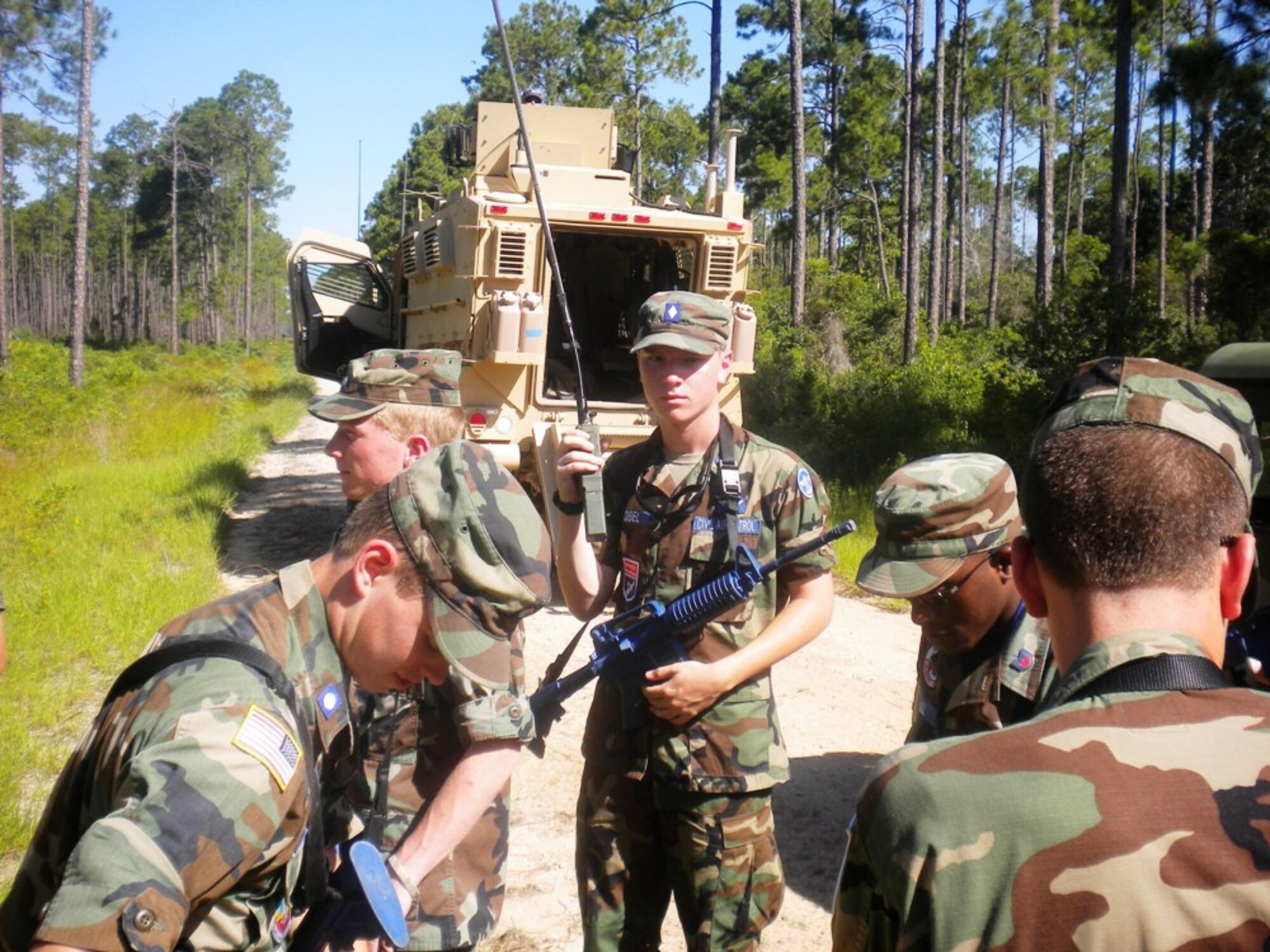 Cadet Maj. Kyle Zobel (center) of North Carolina's Raleigh Wake Composite Squadron uses the radio to coordinate his unit's response during a convoy training exercise at the Civil Air Patrol's Air Force Civil Engineering Academy at Tyndall.(Courtesy photo)
