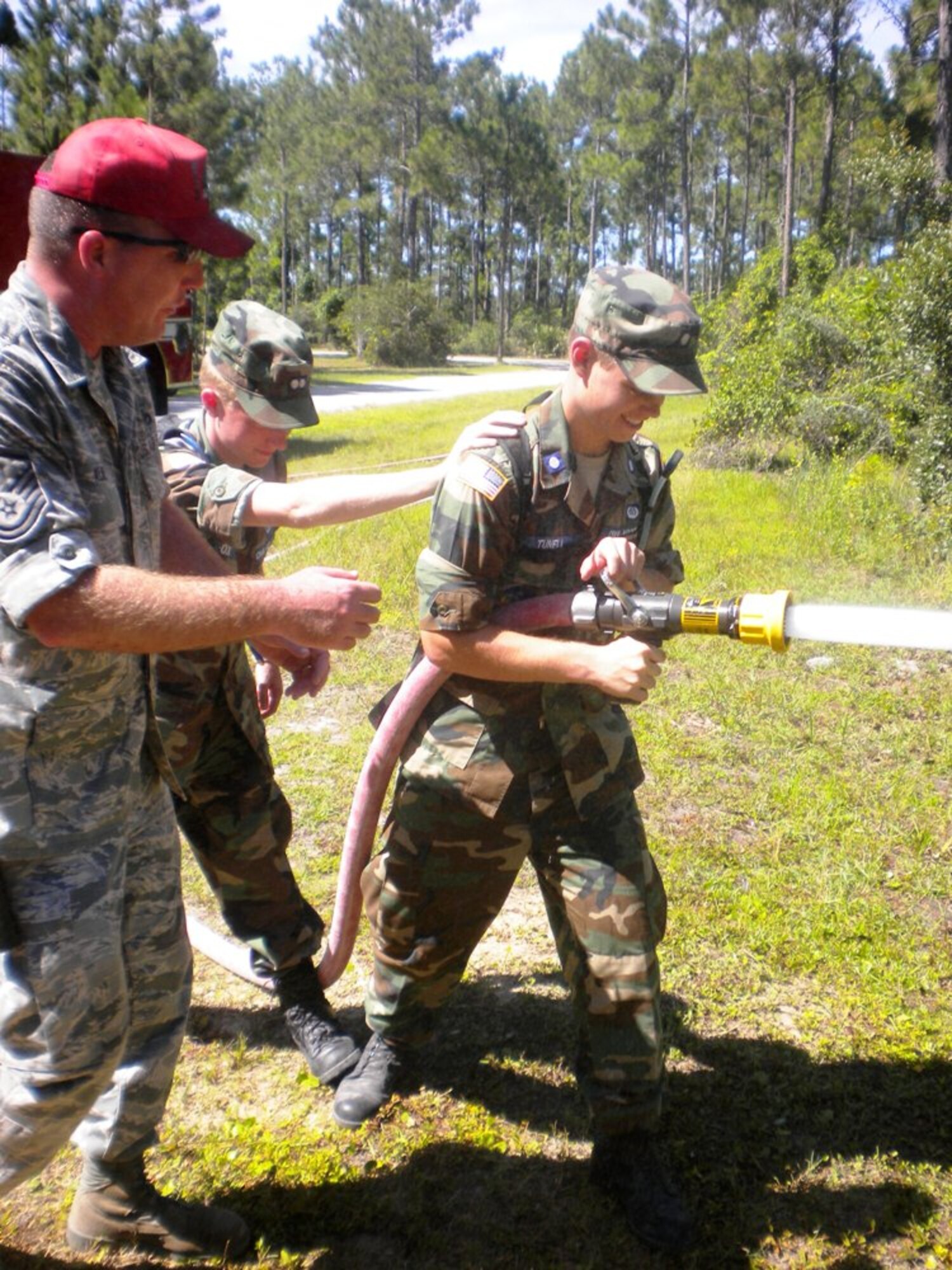 Cadet 2nd Lt. Nicholas Tunnell from Minnesota Wing's St. Paul Composite
Squadron uses a fire hose during a fire fighting demonstration at the Civil Air Patrol's Air Force Civil Engineering Academy at Tyndall. (Courtesy photo)
