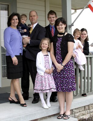 Col. Stephen "S.L." Davis, 341st Misile Wing vice commander, is pictured with his wife, Nancy, and their children. He is holding son Michael, 18 months. Also pictured are Anna, 7; Nicholas, 14; Monica, 18; Gianna, 3; and Elena, 16. (Courtesy photo)