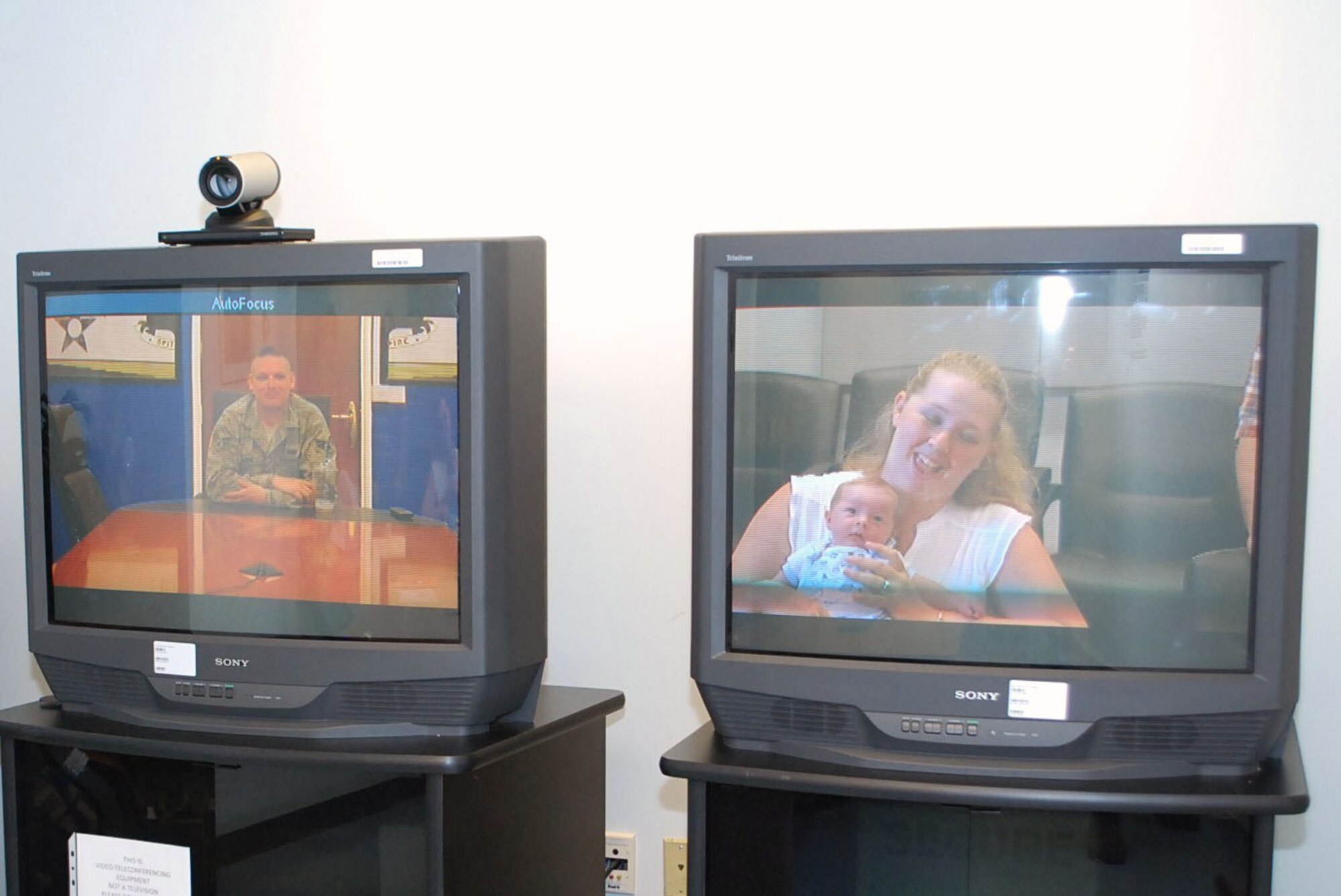Sabrina Clark holds her son, 5-week-old Spencer Thomas Clark, up so her husband Senior Airman William Clark can see the boy for the first time from halfway around the world at Joint Base Ballad on Tuesday. Sabrina Clark attended a video teleconference (VTC) coordinated by Westover's Airman and Family Readiness Center.