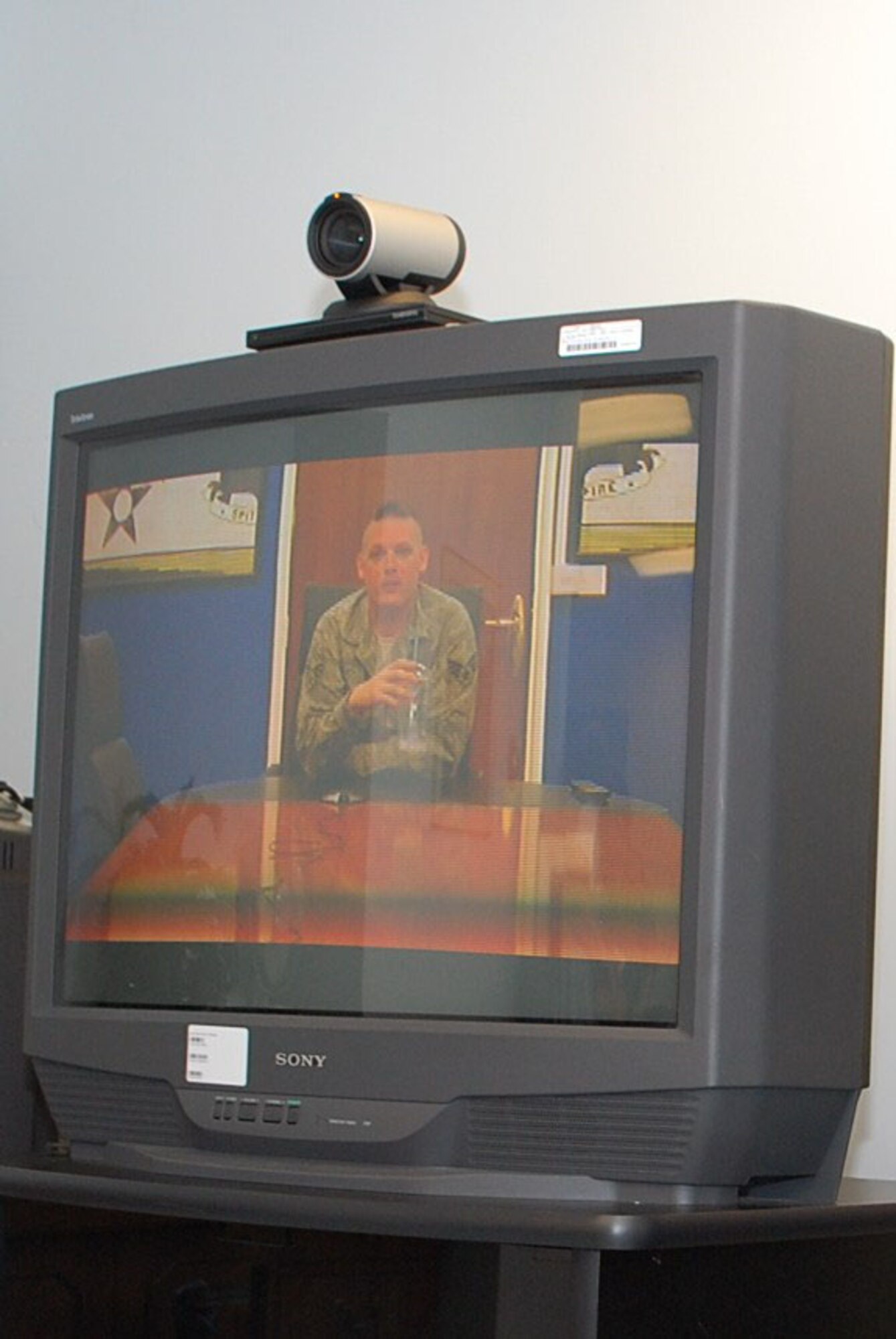 A curious 5-week-old Spencer Thomas Clark looks at his father Senior Airman William Clark for the first time. Airman Clark is forward deployed to Joint Base Ballad.