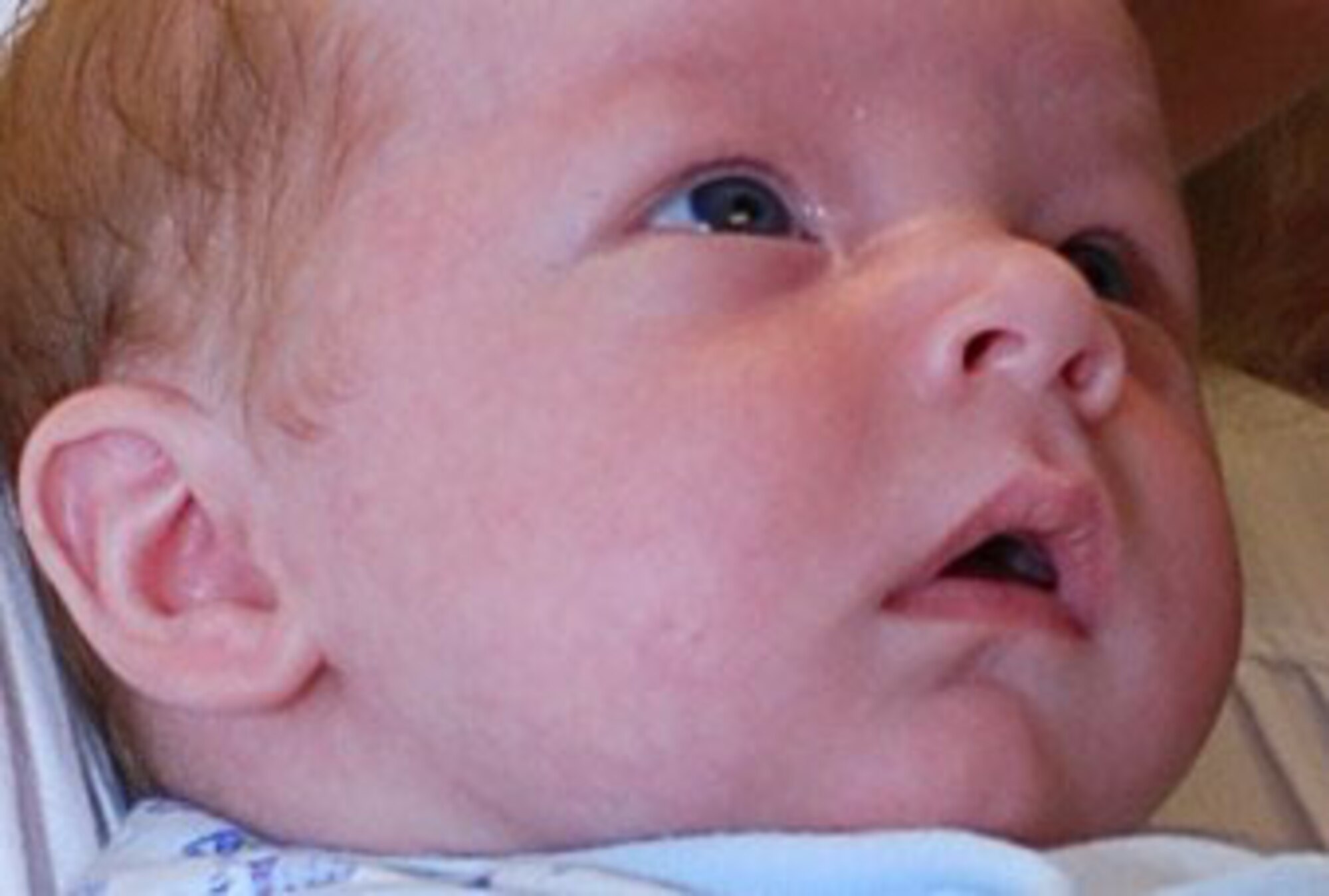 Sabrina Clark holds her son, 5-week-old Spencer Thomas Clark, up so her husband Senior Airman William Clark can see the boy for the first time from halfway around the world at Joint Base Ballad on Tuesday. Sabrina Clark attended a video teleconference (VTC) coordinated by Westover's Airman and Family Readiness Center.