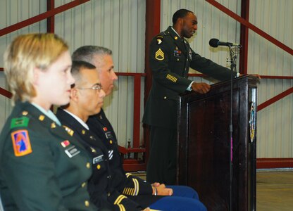 SOTO CANO AIR BASE, Honduras --  Asking each of his Soldiers to continue with their individual strengths, Staff Sgt. Arrington Lett, the 1-228th Aviation Regiment motor pool NCO in charge, speaks at the memorial ceremony for two fallen Soldiers here Aug. 5. Sgt. Leodegario Lizárraga and Sgt. Luis Brito, both 1-228th Soliders, died in a car accident July 31. (U.S. Air Force photo/Martin Chahin)
