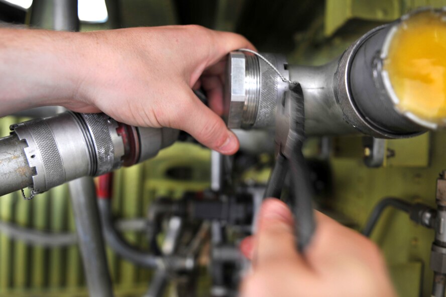 A fuel pipe is repaired by a 19th Component Maintenance Squadron Airman July 16, 2010, on a C-130 aircraft training wing at Little Rock Air Force Base, Ark. (U.S. Air Force Photo/Senior Airman Steele C. G. Britton) 