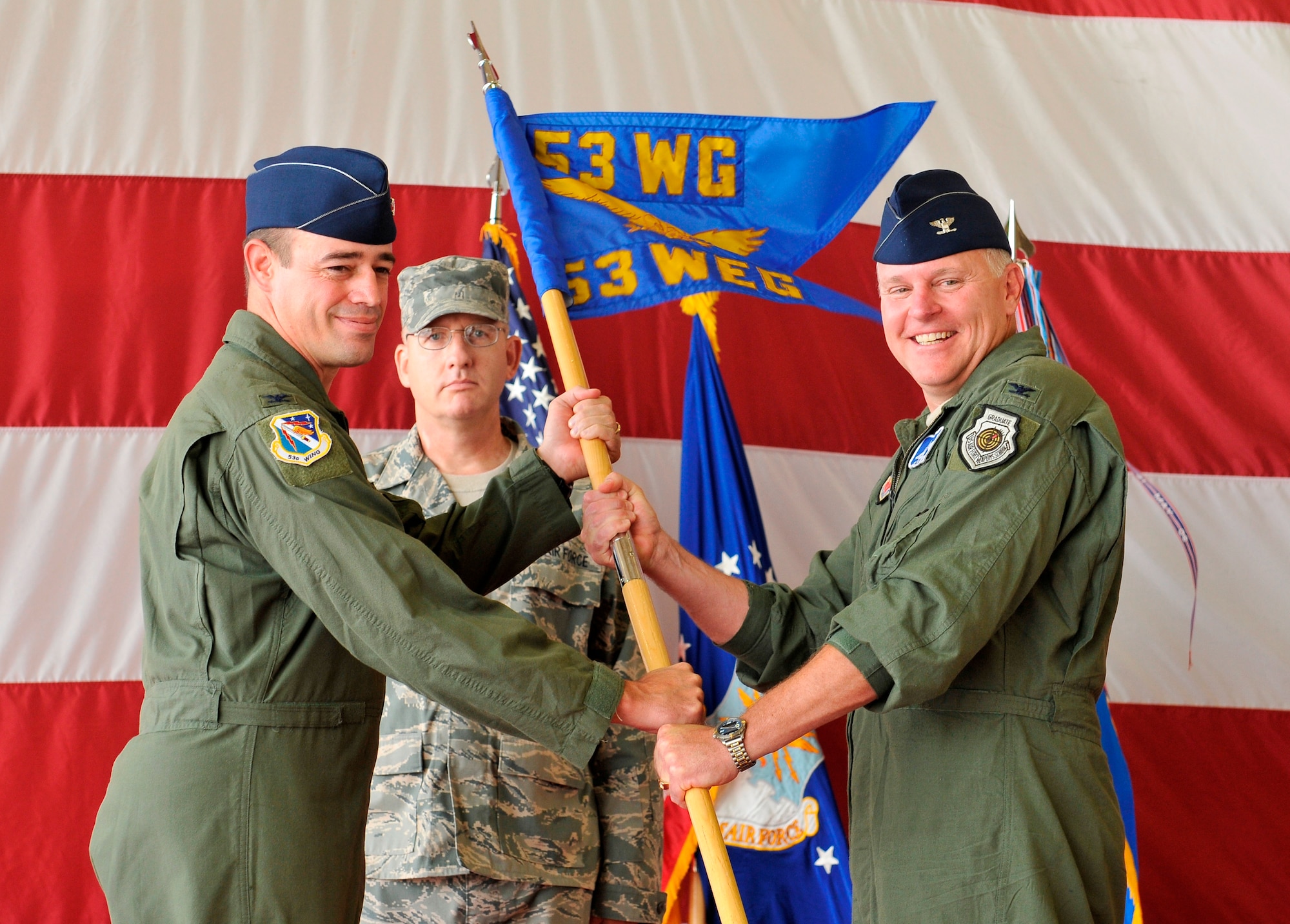 Colonel Bert Dreher accepts the 53rd Weapons Evaluation Group guidon from Col. Michael Gantt, 53rd Wing commander, during a Change of Command ceremony July 23 at Tyndall.  Colonel Dreher replaces Col. Michael MacWilliam as the 53rd WEG commander. (U.S. Air Force photo/Lisa Norman)
