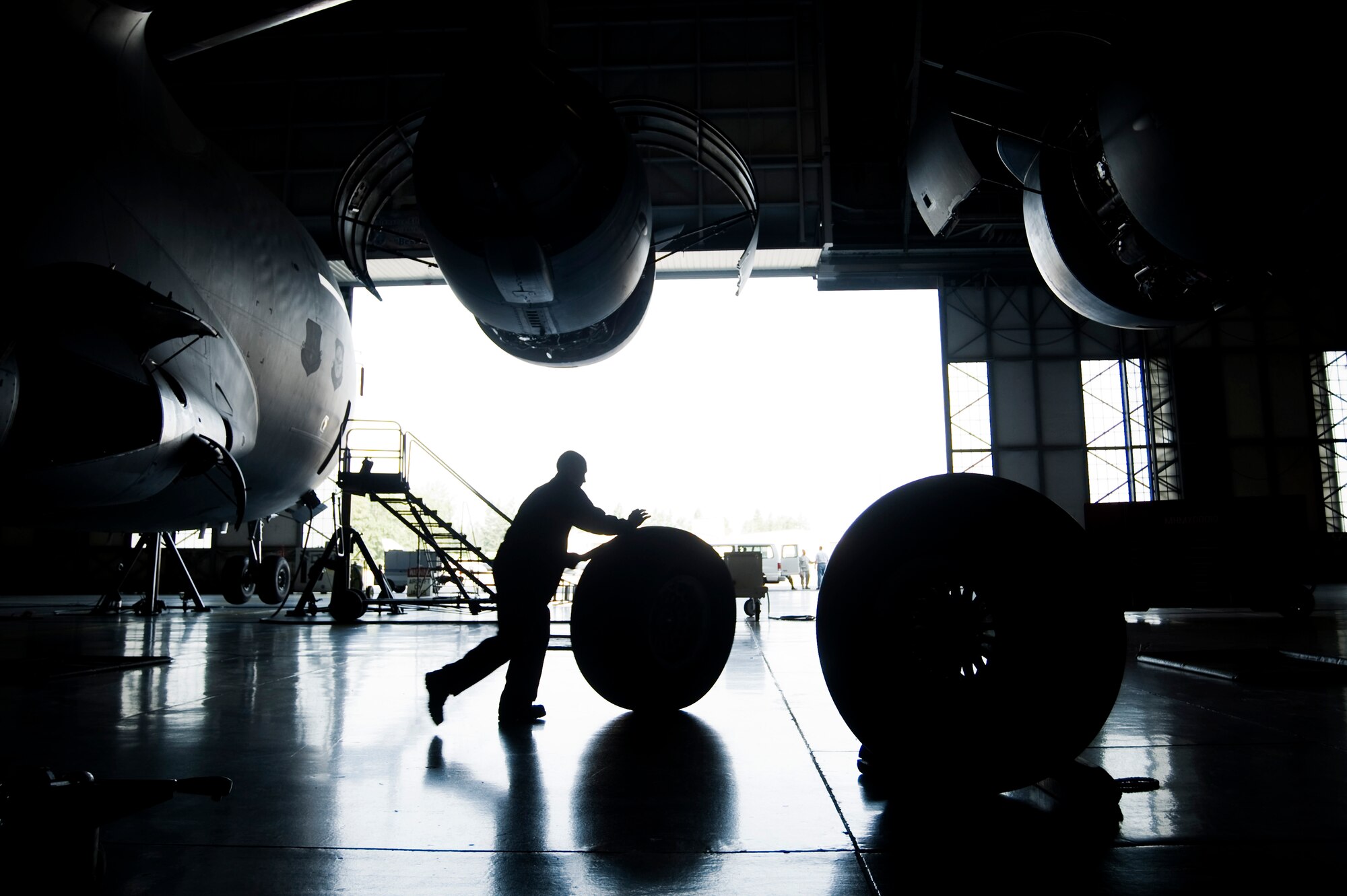 Airman Andrew Boomershine, 62nd Maintenance Squadron, relocates a serviceable C-17 Globemaster III tire to a staging area in a hangar at McChord Field Aug. 5. (U.S. Air Force photo/Abner Guzman)

