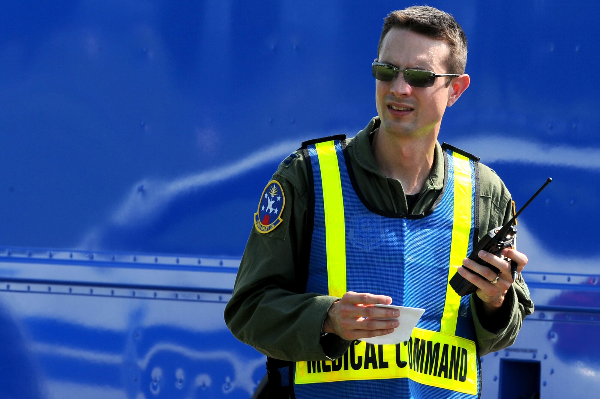 Capt. Richard Hoyt, 375th Aerospace Medicine Squadron flight surgeon, relays information from a simulated crash scene to the emergency operation center during a Major Accident Response Exercise at Scott AFB, August 3, 2010. The exercise was conducted in preparation for the upcoming air show on September 11-12. It tested emergency teams' capability to respond and control a crash scene in the event of a real world incident. (U.S. Air Force photo by Staff Sgt. Brian J. Ellis)