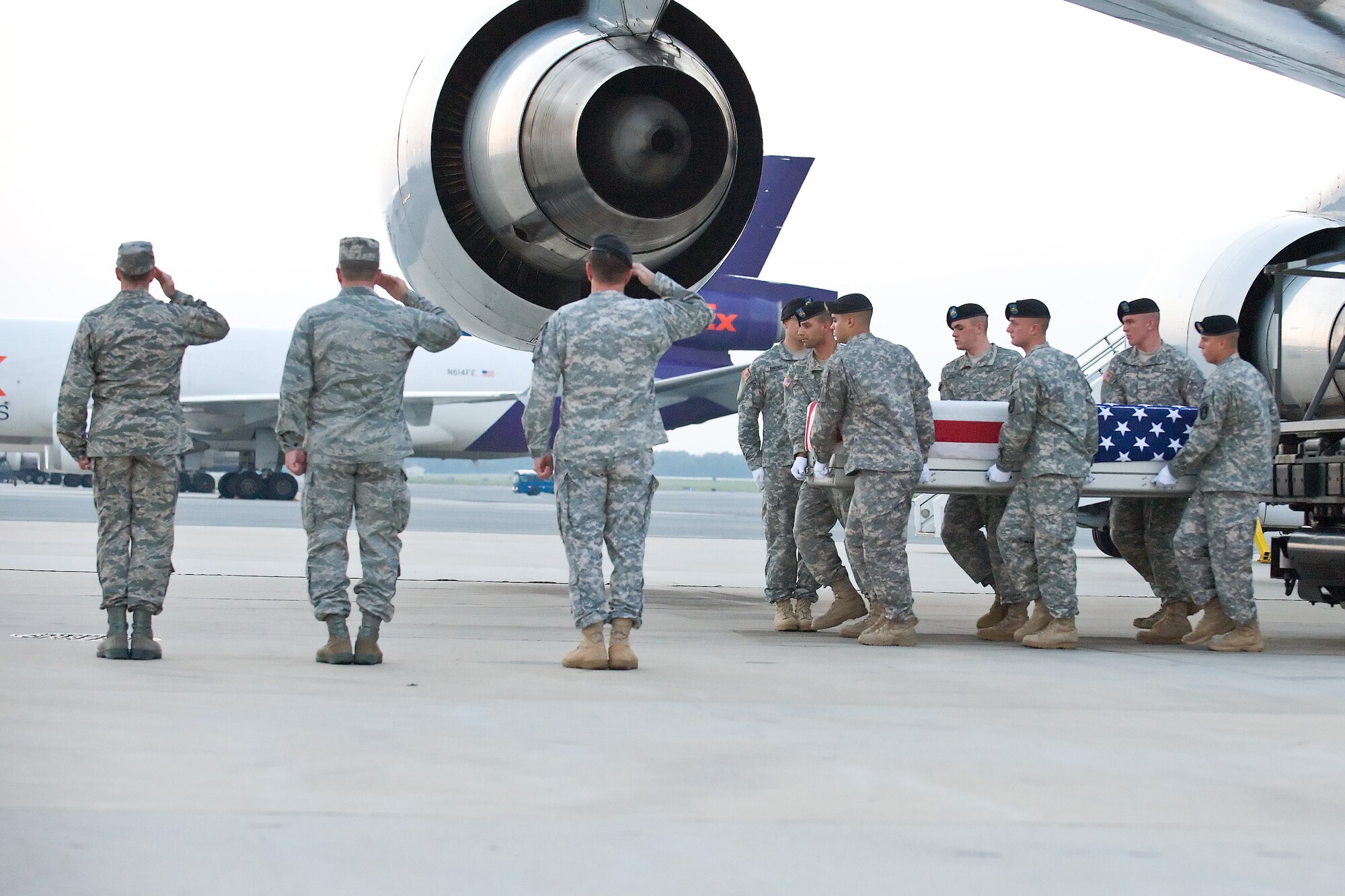 A U.S. Army carry team transfers the remains of Army Pfc. James J. Oquin, of El Paso, Texas, at Dover Air Force Base, Del., July 24. Pfc. Oquin was assigned to the 1st Battalion, 187th Infantry Regiment, 3rd Brigade Combat Team, 101st Airborne Division (Air Assault), Fort Campbell, Ky. (U.S. Air Force photo/Roland Balik)