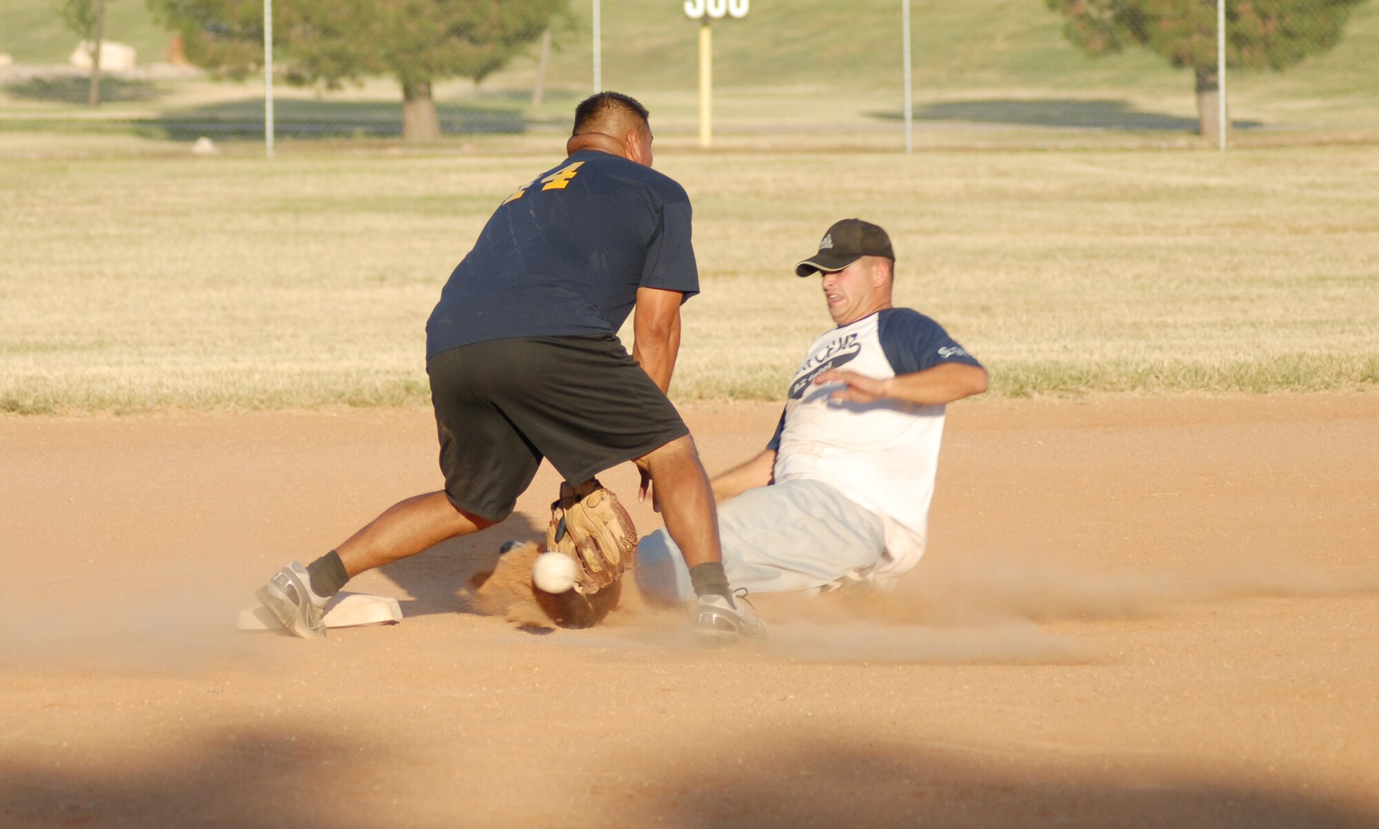 Kendal Beasley, 315th Training Squadron, slides safely to second against Santos Pena, 17th Mission Support Group. 17 MSG defeated the 315 TRS, 17-11, after a doubleheader Aug. 4 taking the 2010 Intramural Softball championship, 15-12. (U.S. Air Force photo/Connie Hempel)