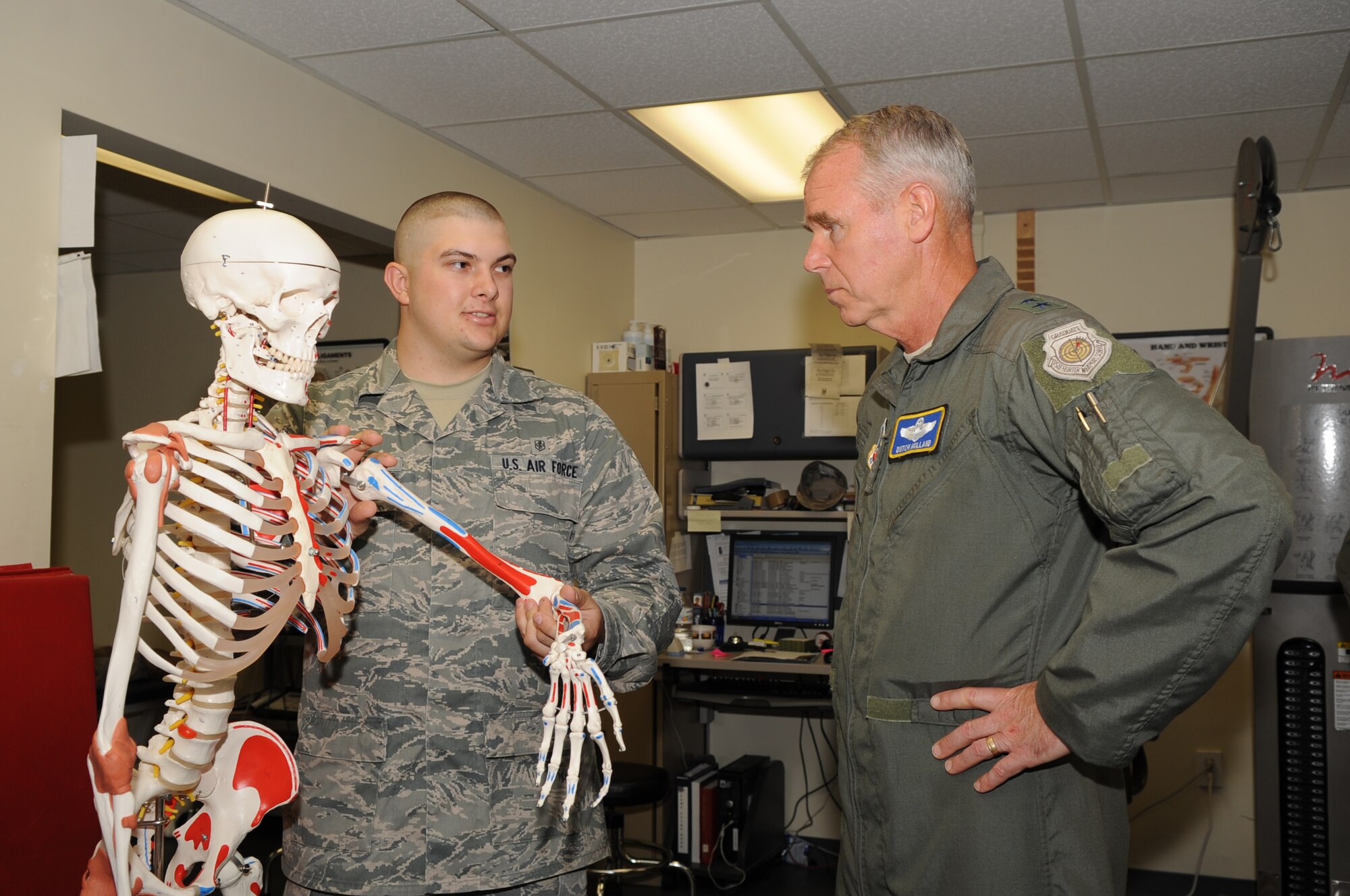 SEYMOUR JOHNSON AIR FORCE BASE, N.C. -- Airman 1st Class Randy Slaba informs Maj. Gen. William Holland about injuries the physical therapy flight sees related to the Air Force physical training test here Aug. 3, 2010. As of July 1, 2010 all Airmen must take their PT test twice a year.  Airman Slaba, 4th Medical Group physical therapy technician, is from North Platte, Neb.  (U.S. Air Force photo /Staff Sgt. Courtney Richardson)