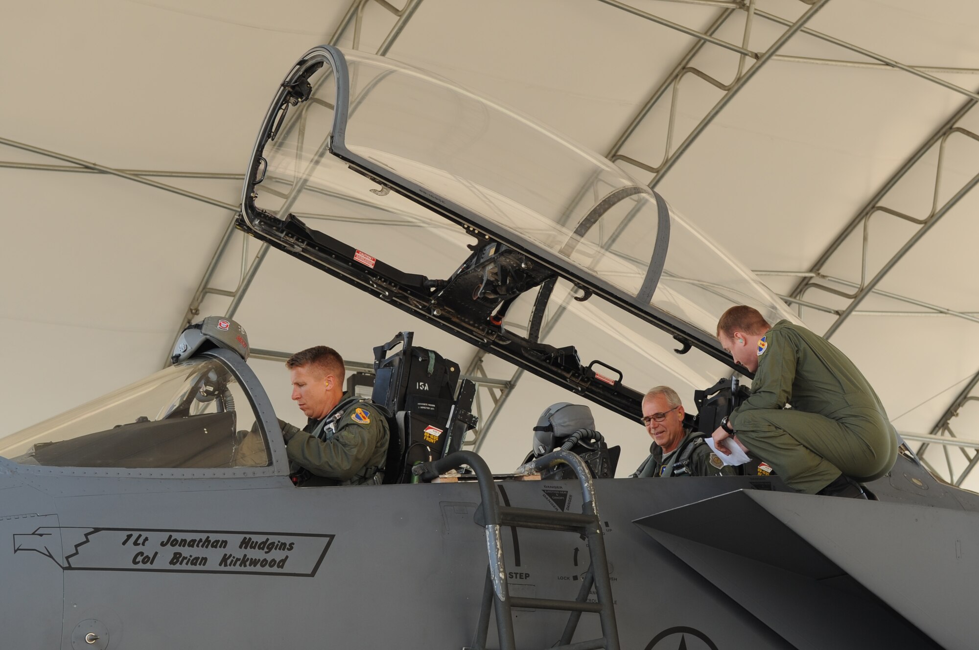 SEYMOUR JOHNSON AIR FORCE BASE, N.C. -- Maj. Gen. William Holland receives a F-15E Strike Eagle egress briefing from Capt. Timothy Swiechowicz while preparing for a flight with Col. Patrick Doherty here Aug. 3, 2010. Prior to his flight, the general attended a mission brief and stopped by the 335th Fighter Squadron life support for a mask test and flight gear. Captain Swiechowicz, 335th FS pilot, is from Great Falls, Mont. General William Holland is the commander, 9th Air Force, Air Combat Command, Shaw Air Force Base, S.C., and Colonel Doherty is the commander, 4th Fighter Wing. (U.S. Air Force photo /Staff Sgt. Courtney Richardson)