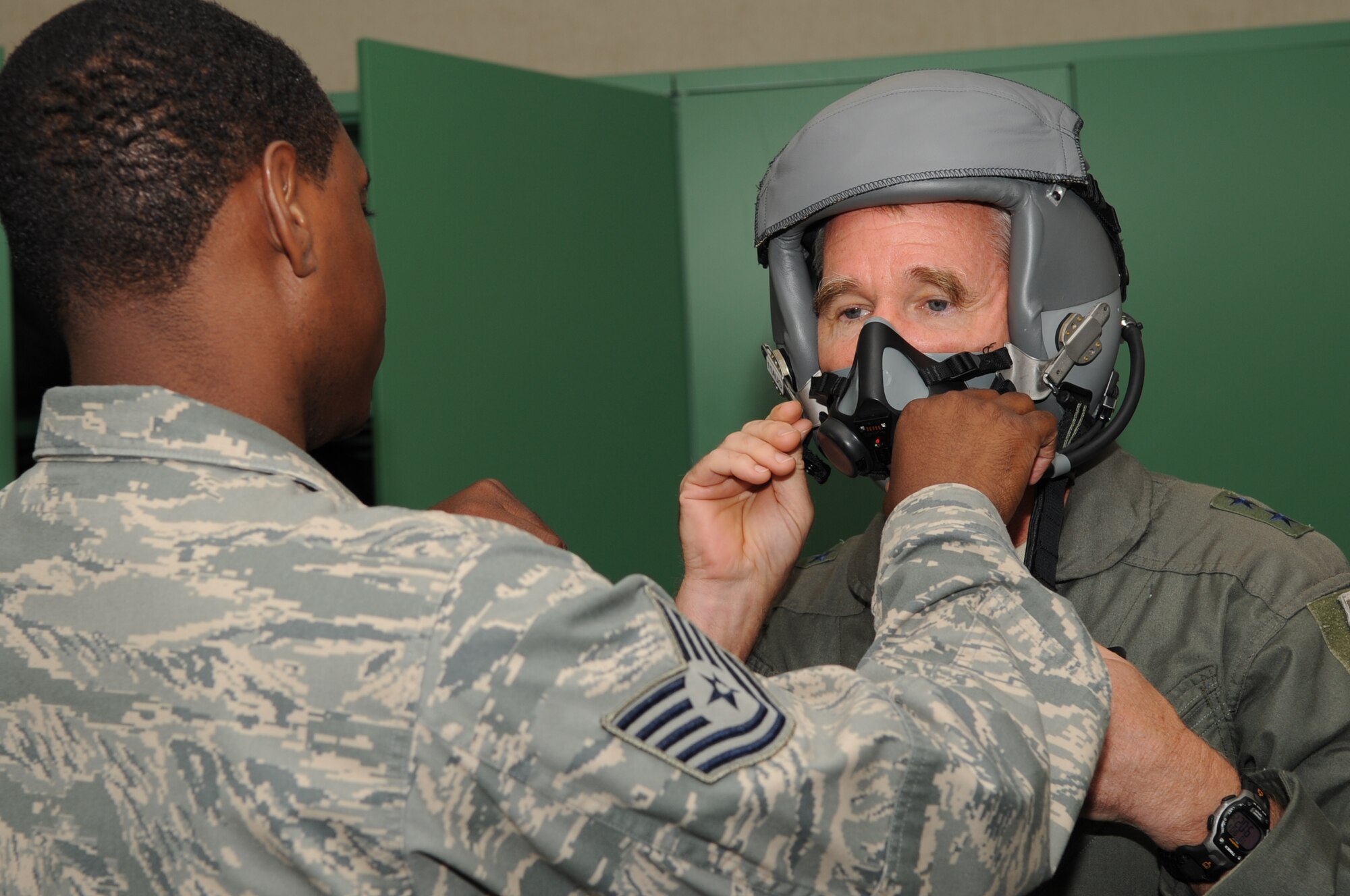 SEYMOUR JOHNSON AIR FORCE BASE, N.C. -- Tech. Sgt. Clint Haynes tests Maj. Gen. William Holland's mask for leaks prior to his flight in an F-15E Strike Eagle here Aug. 3, 2010. In addition to his flight with the 335th Fighter Squadron, General Holland also visited Airmen at the 4th Medical Group, 4th Security Forces Squadron, 4th Maintenance Group, the fitness center and the Personnel Deployment Facility. Sergeant Haynes, 335th Fighter Squadron aircrew flight equipment craftsman, hails from Compton, Calif. General Holland is the commander, 9th Air Force, Air Combat Command, Shaw Air Force Base, S.C. (U.S. Air Force photo /Staff Sgt. Courtney Richardson)