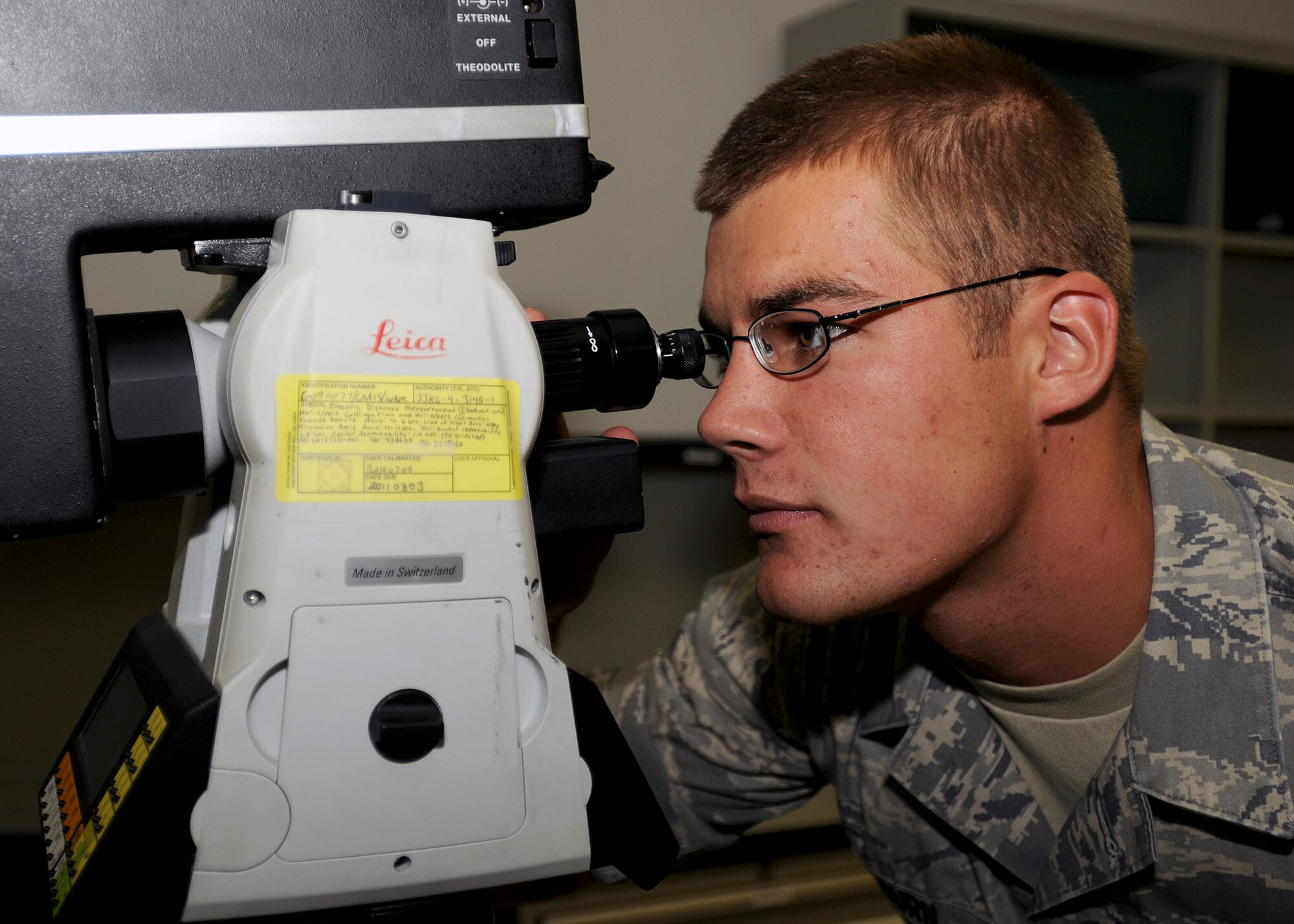 Airman 1st Class Michael Kilburn, 31st Maintenance Squadron Avionics Intermediate Section journeyman, performs alignments on an optical test bench for a head-up display August 6.  The Avionics Intermediate Sections is responsible for the maintenance on all avionic components of Aviano's Fighting Falcons.  (U.S. Air Force photo/Senior Airman Tabitha M. Lee)