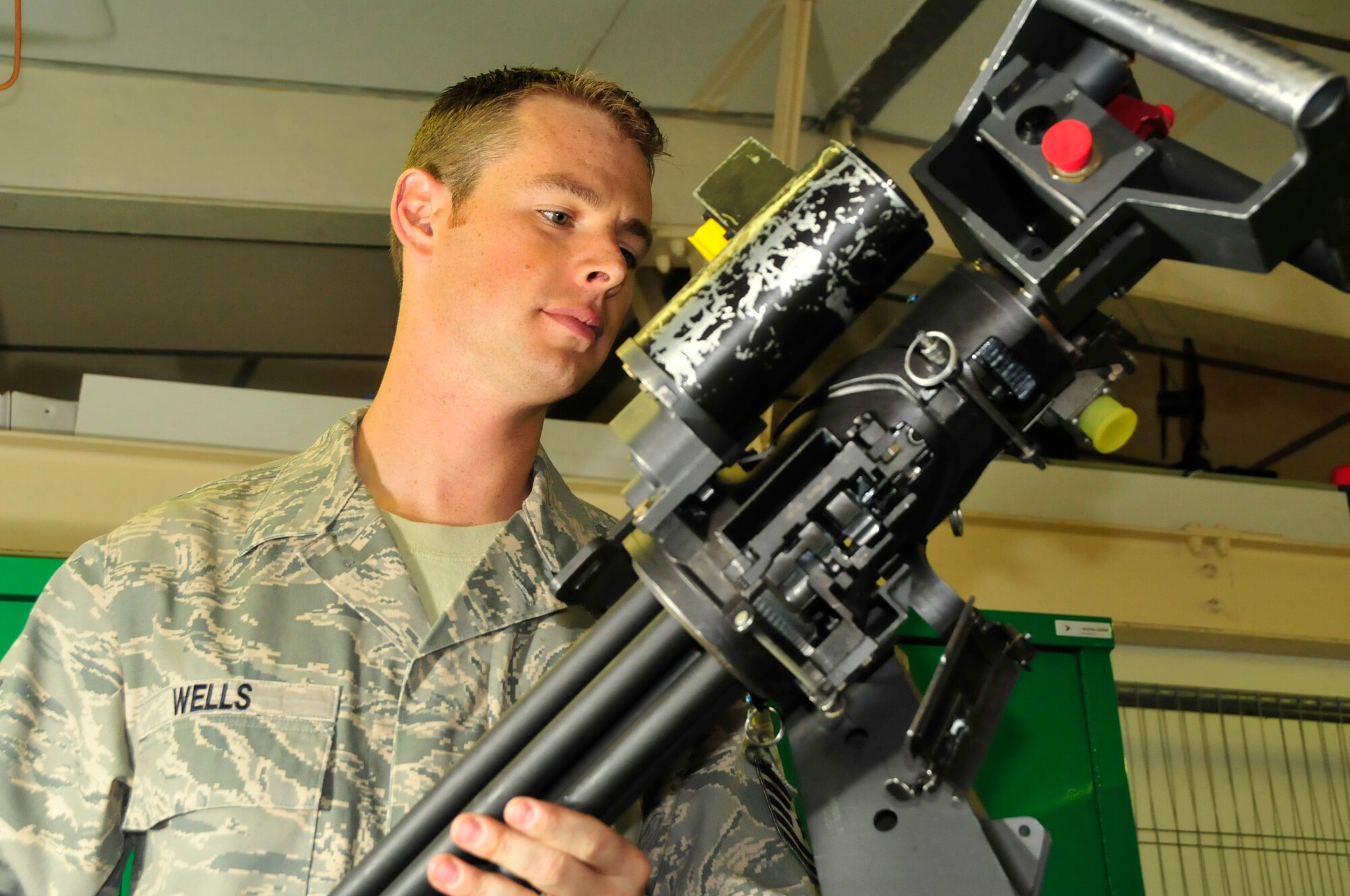 Tech. Sgt. Adam Wells, 56th Aircraft Maintenance Unit weapons assistant flight chief, performs a seven level inspection on a GAU-2 mini gun August 4. Sergeant Wells was nominated for a Liberty Spotlight because he displays the core value of Excellence in All We Do.(U.S. Air Force photo by Airman 1st Class Eboni Knox)