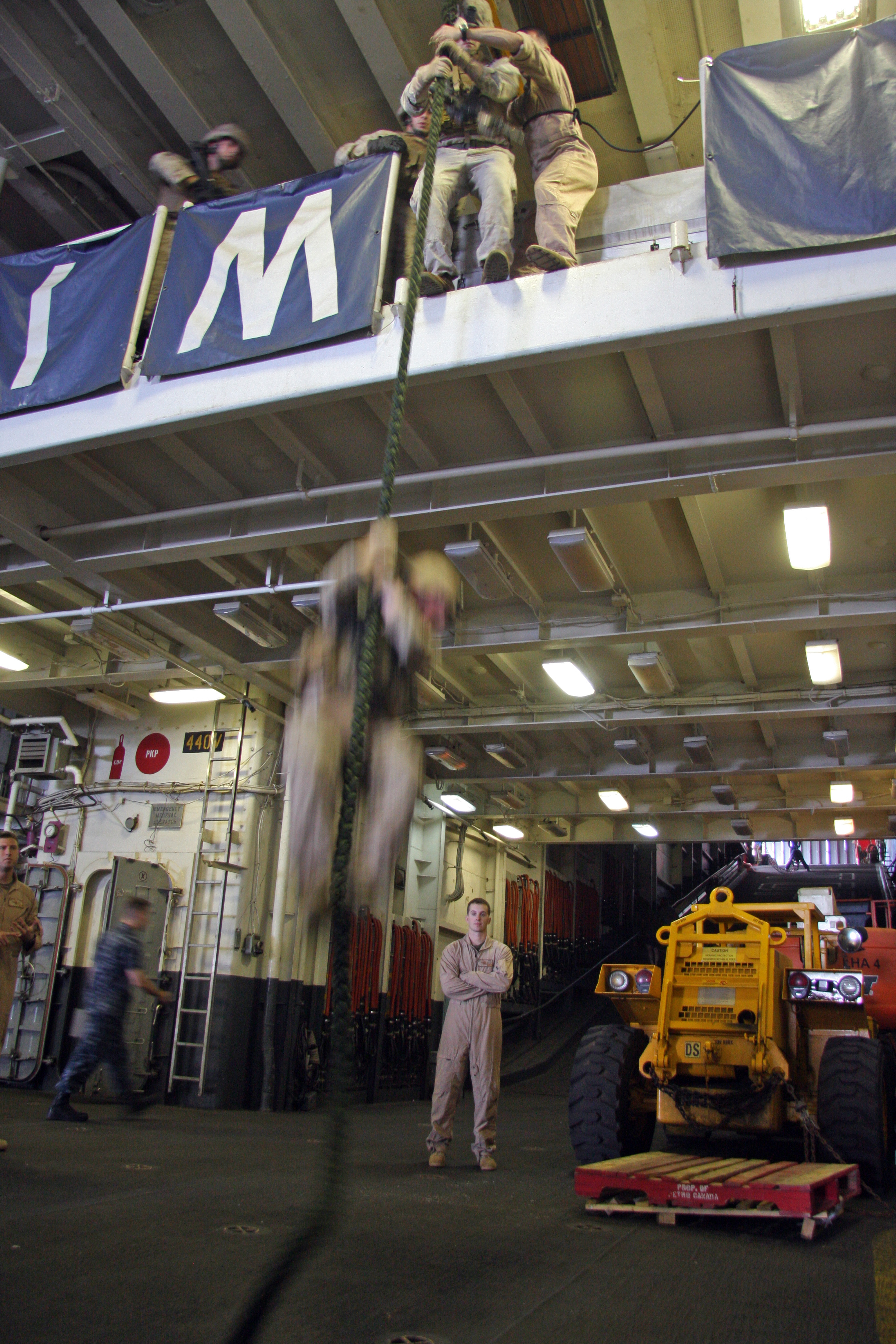 Corporals of the 24th Marine Expeditionary Unit perform a Vessel Board Search and Seizure exercise as their culminating field operation during a Corporal's Course aboard USS Nassau, Aug. 6. The course began July 12, and will end Aug. 9. This was an effort to maintain the field training operations implemented in a Corporal's Course. Due to the lack of ability to go to the field this was the best way for them to get the training. These Marines embarked upon USS Nassau approximately seven months ago and will be arriving home shortly. This course will send them back to their parent commands well prepared and ready to take on the next level as a Marine.