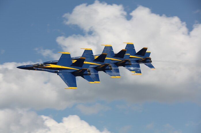 Four Navy Blue Angel F/A-18 Hornets pierce the sky during their performance at the 2010 MCAS Cherry Point Air Show. The Blue Angels headlined the show and dazzled spectators with their stunning acrobatics and daring maneuvers.
