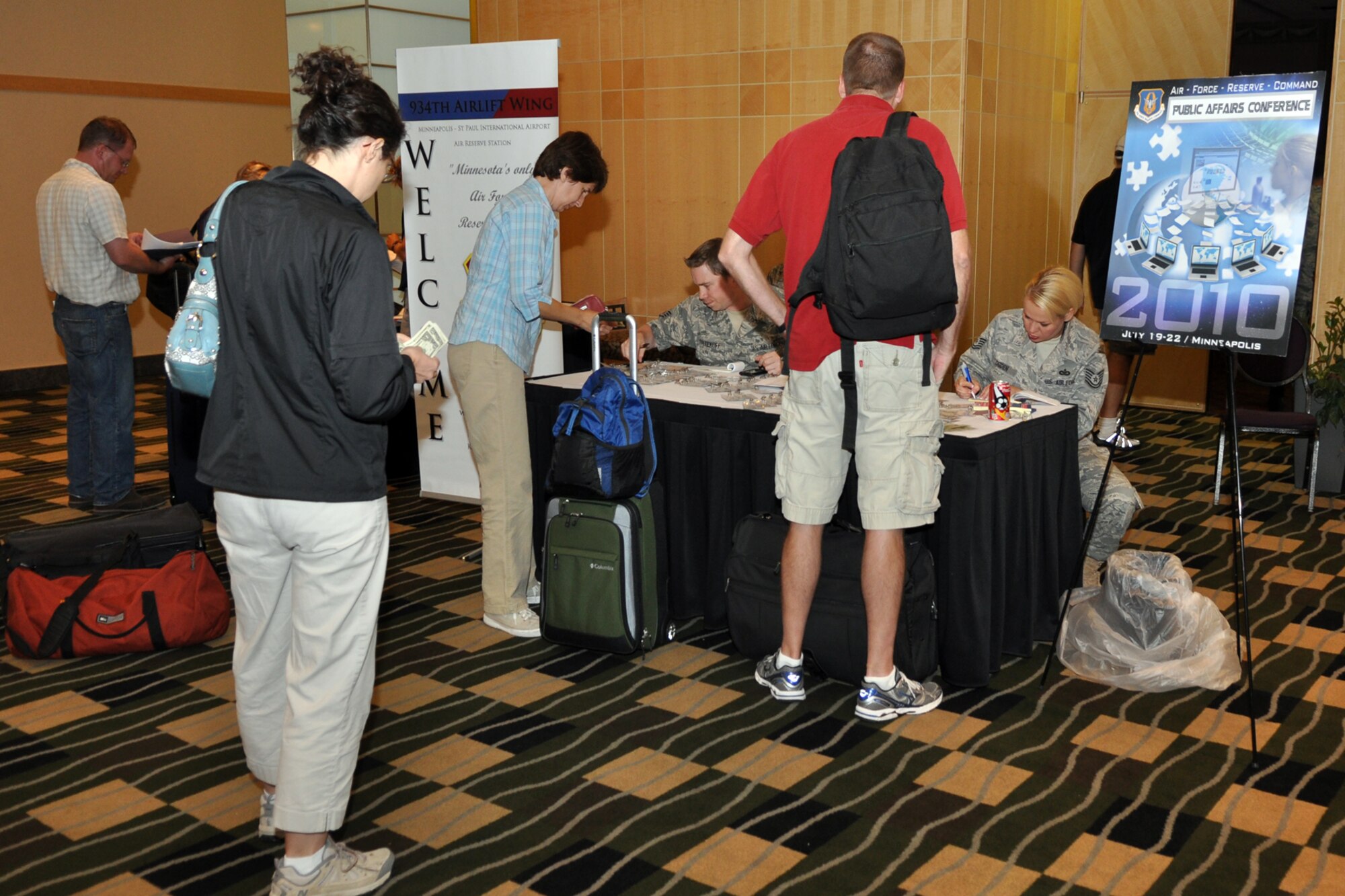 Air Force Reserve Command public affairs professionals sign in at the AFRC Public Affairs Conference at the Millennium Hotel in Minneapolis, Minn., July 19, 2010. The conference, which is hosted every two years, allows PA representatives from throughout the AFRC to network over a three-day period and receive training they can’t get anywhere else. Over 170 PA professionals took part in the conference from July 20-22. (U.S. Air Force photo/Tech. Sgt. Jeff Walston)

