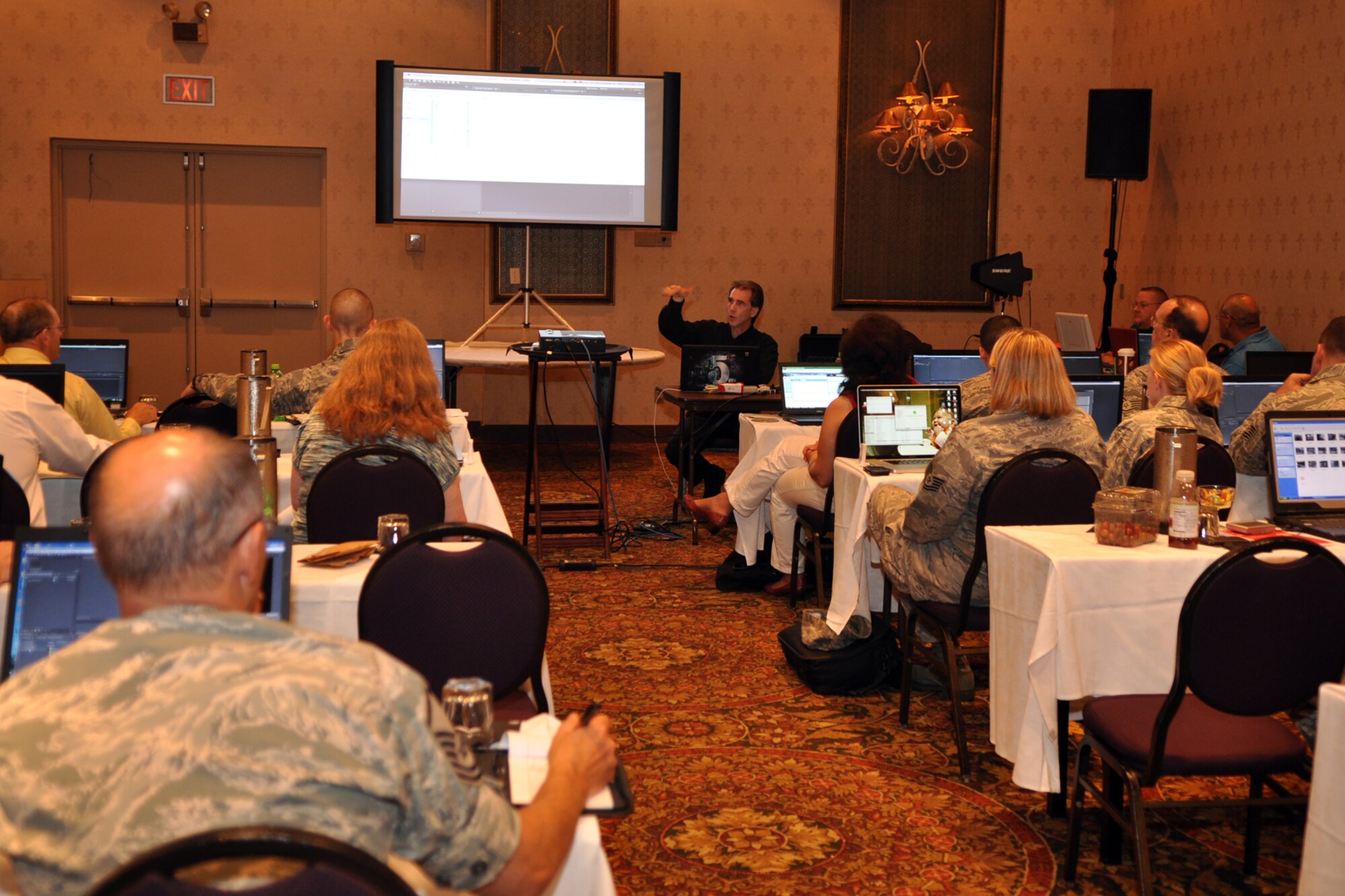 David K. Helmly Sr., an Adobe certified expert, instructs Air Force Reserve Command public affairs professionals at the AFRC Public Affairs Conference in Minneapolis, Minn., July 19, 2010. The conference, which is hosted by the AFRC every two years, allows public affairs representatives from throughout the AFRC to meet over a three-day period and receive training in many different areas they cannot get anywhere else. (U.S. Air Force photo/Tech. Sgt. Jeff Walston)