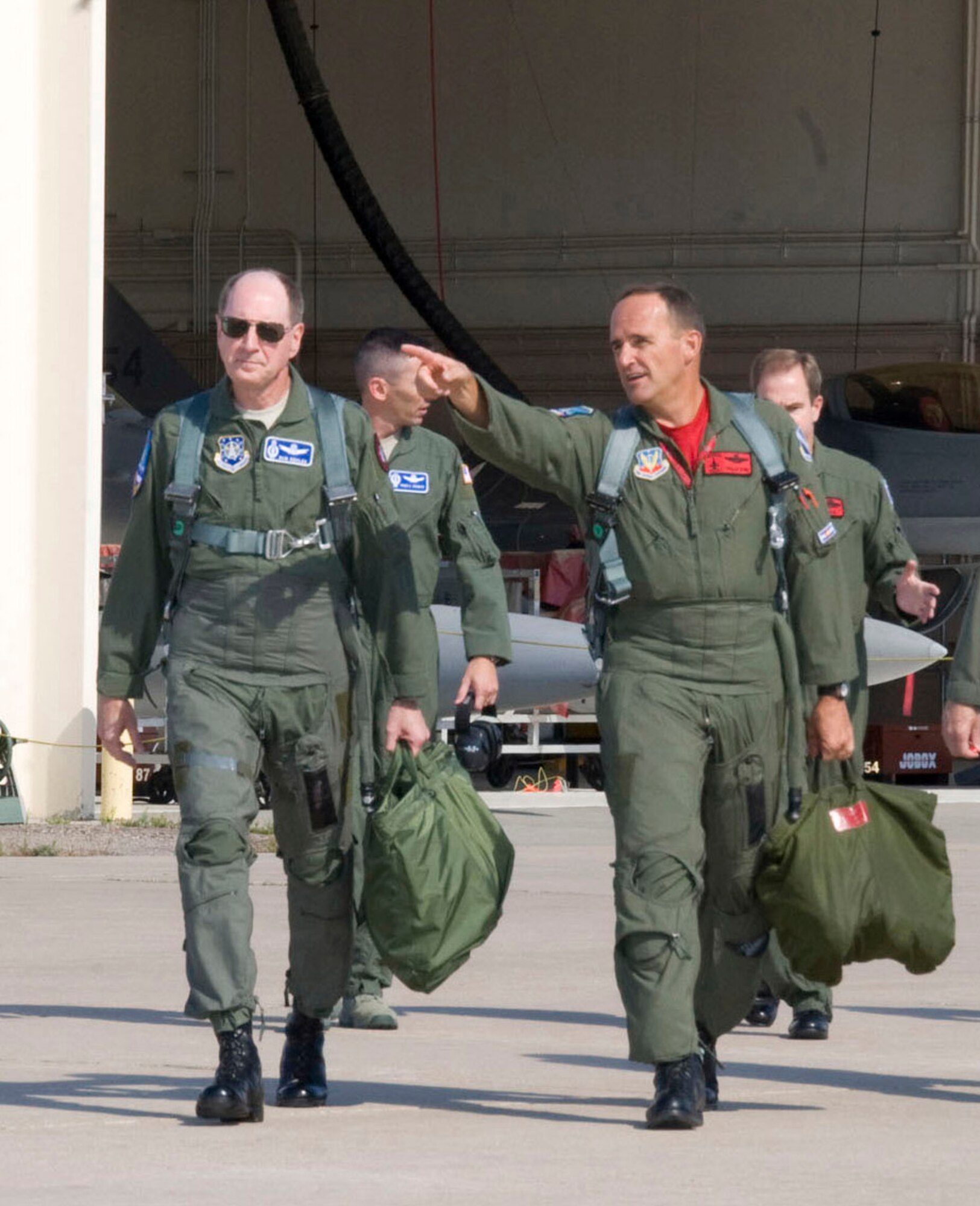 Gen. C. Robert Kehler, Air Force Space Commander and Brig. Gen. Trulan A. Eyre, 140th Wing Commander, step to the F-16 prior to takeoff.  Gen Kehler spent the day learning about the missions of the Colorado Air National Guard as well as spending time with Airmen from the 460th Space Wing at Buckley Air Force Base.