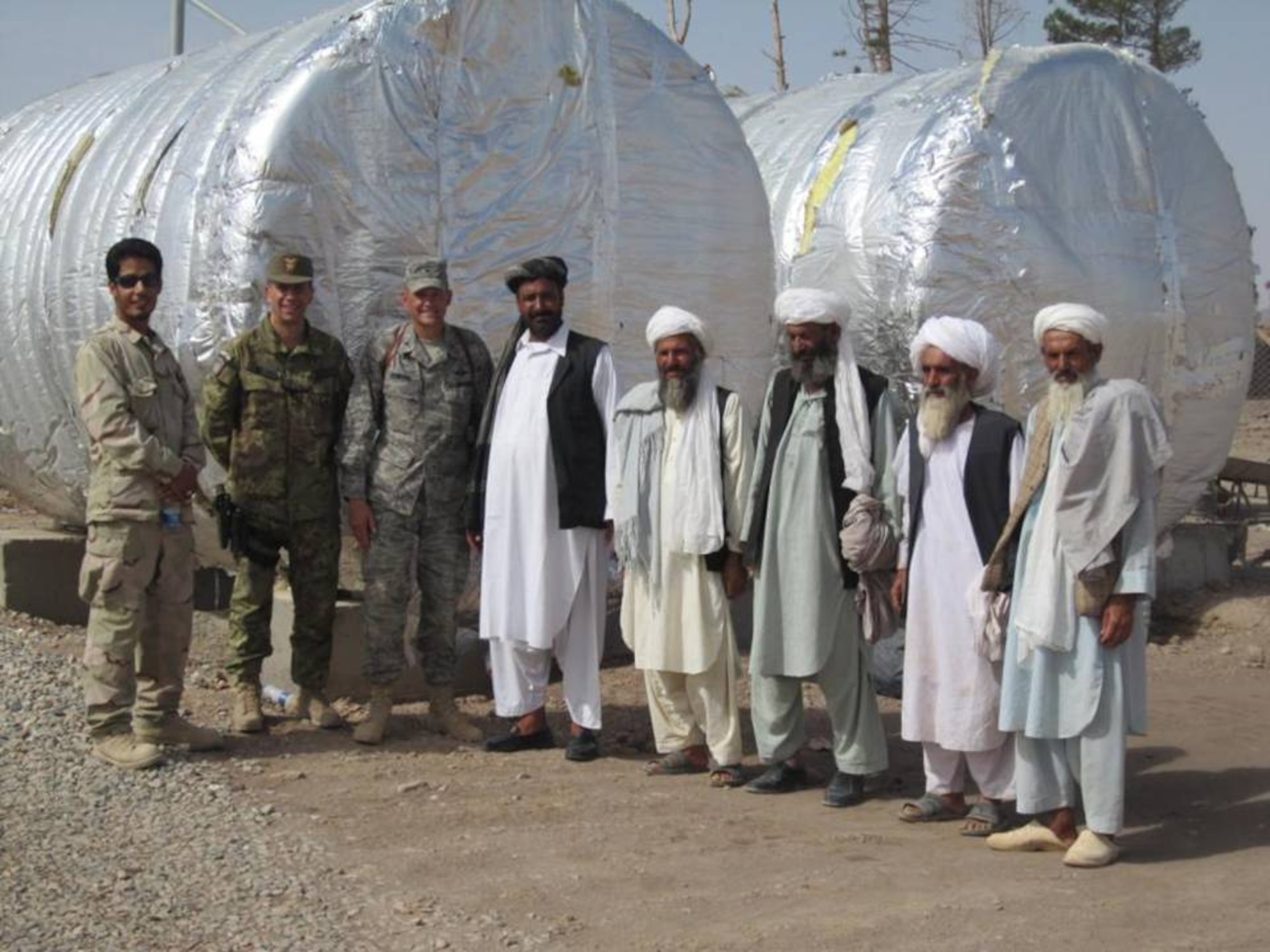 SHINDAND, Afghanistan - Members of the Afghan Air Force, Combined Air Power Transition Force and Task Force Center met with Deh Ali Baig village elders to discuss ways the Afghan National Security Forces and Coalition partners can assists their civilian neighbors on Aug. 5, 2010.  